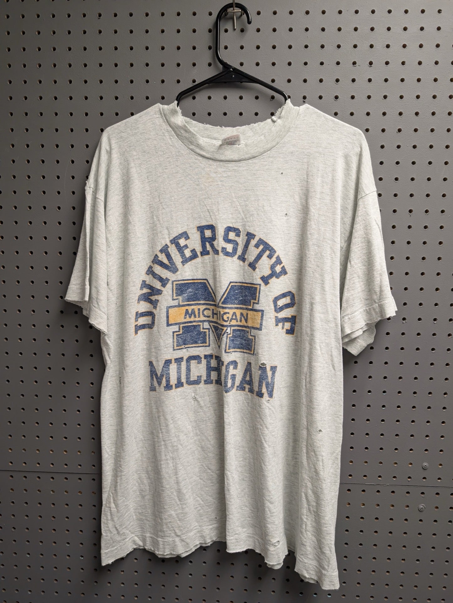 Front view of distressed University of Michigan grey vintage t-shirt