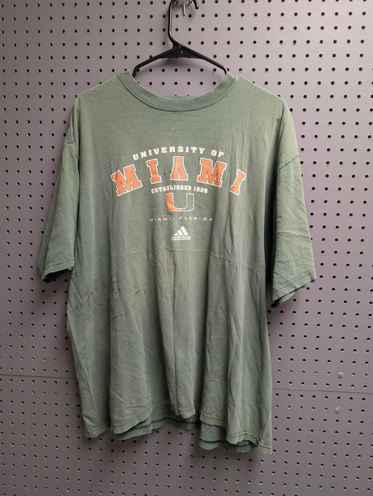 Front view of green Adidas Miami Hurricanes t-shirt