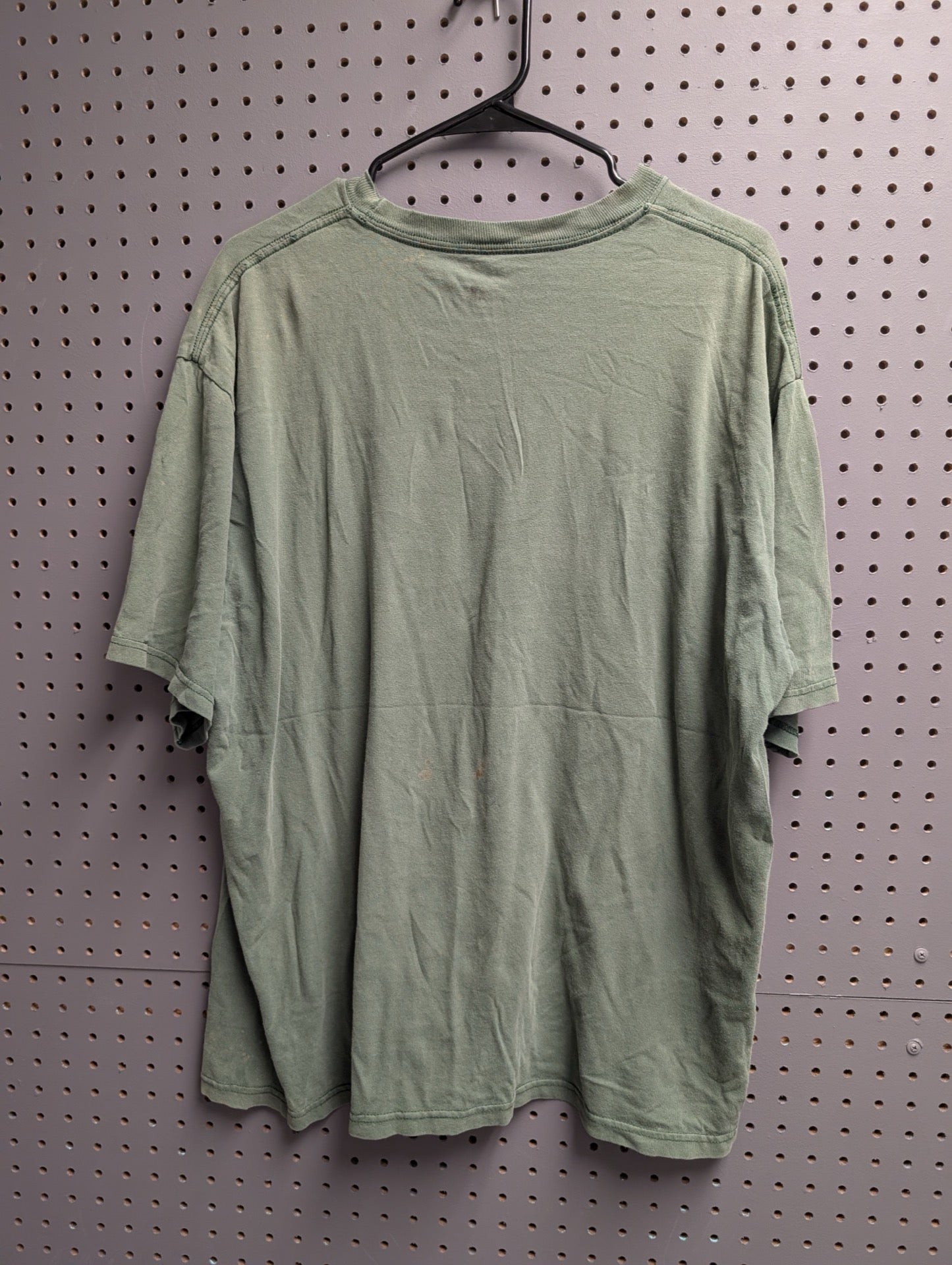 Back view of green Adidas Miami t-shirt showing stains
