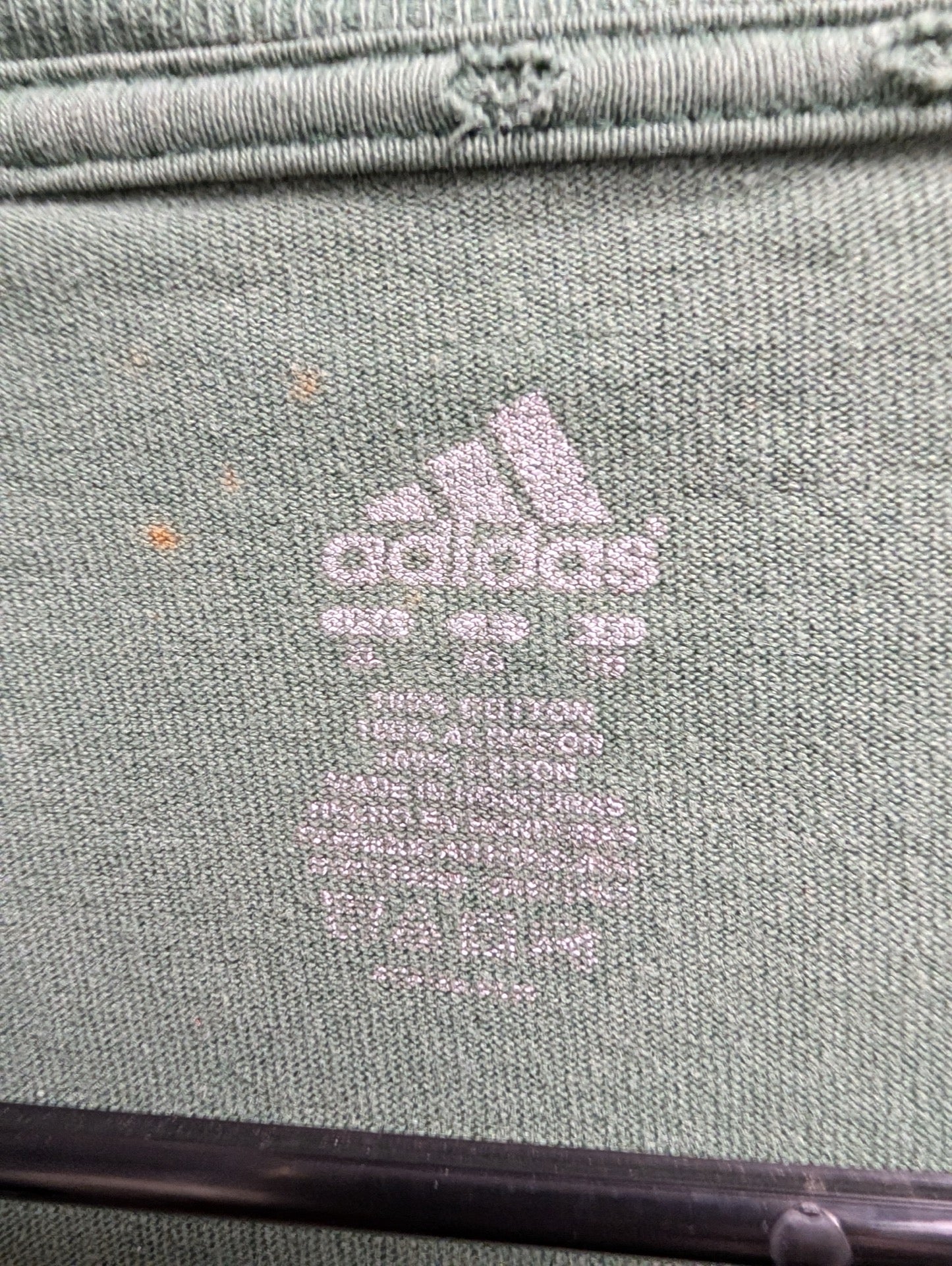 Printed Adidas neck tag showing size XL