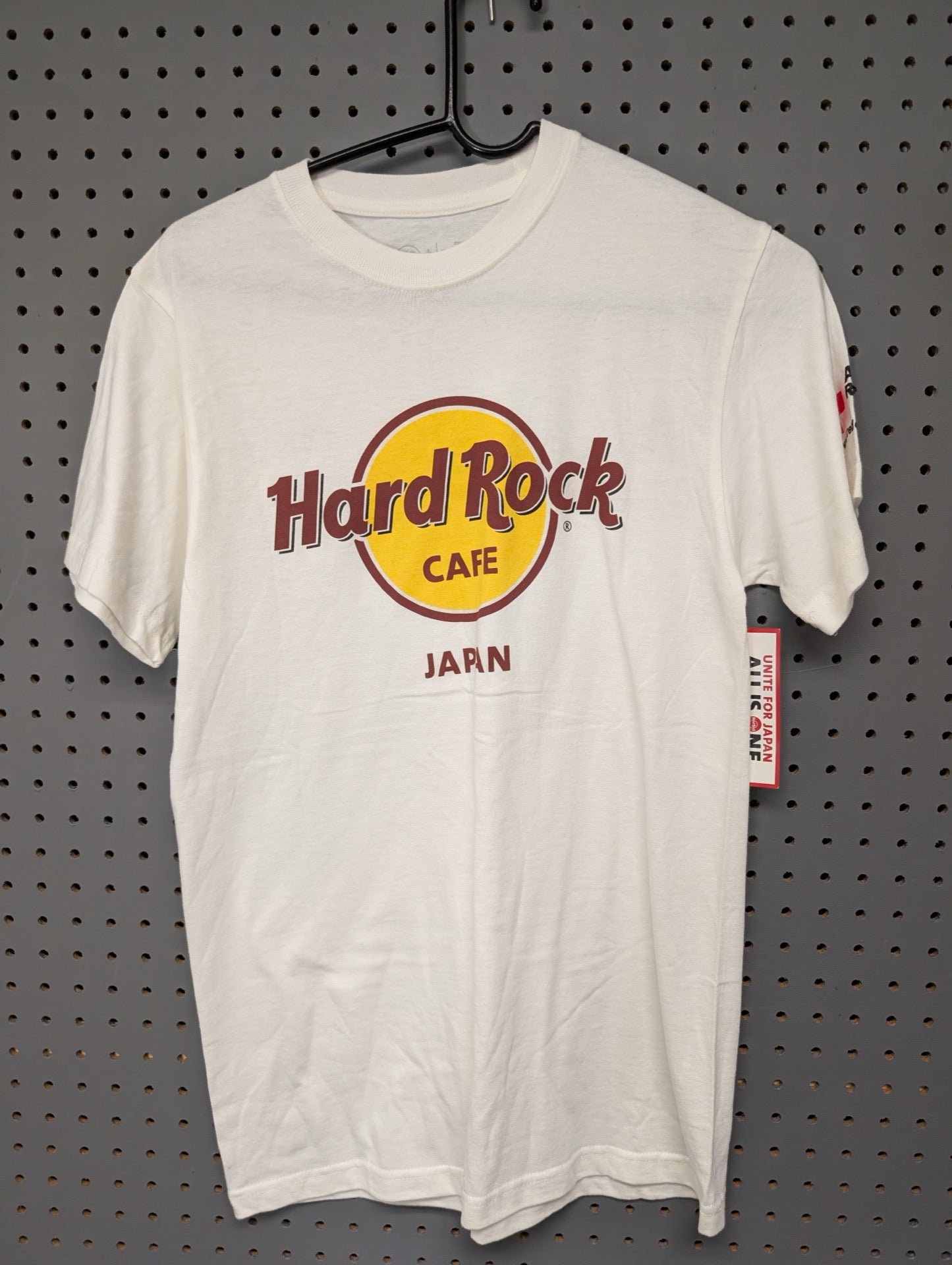 Front view of white Hard Rock Cafe Japan t-shirt with tags