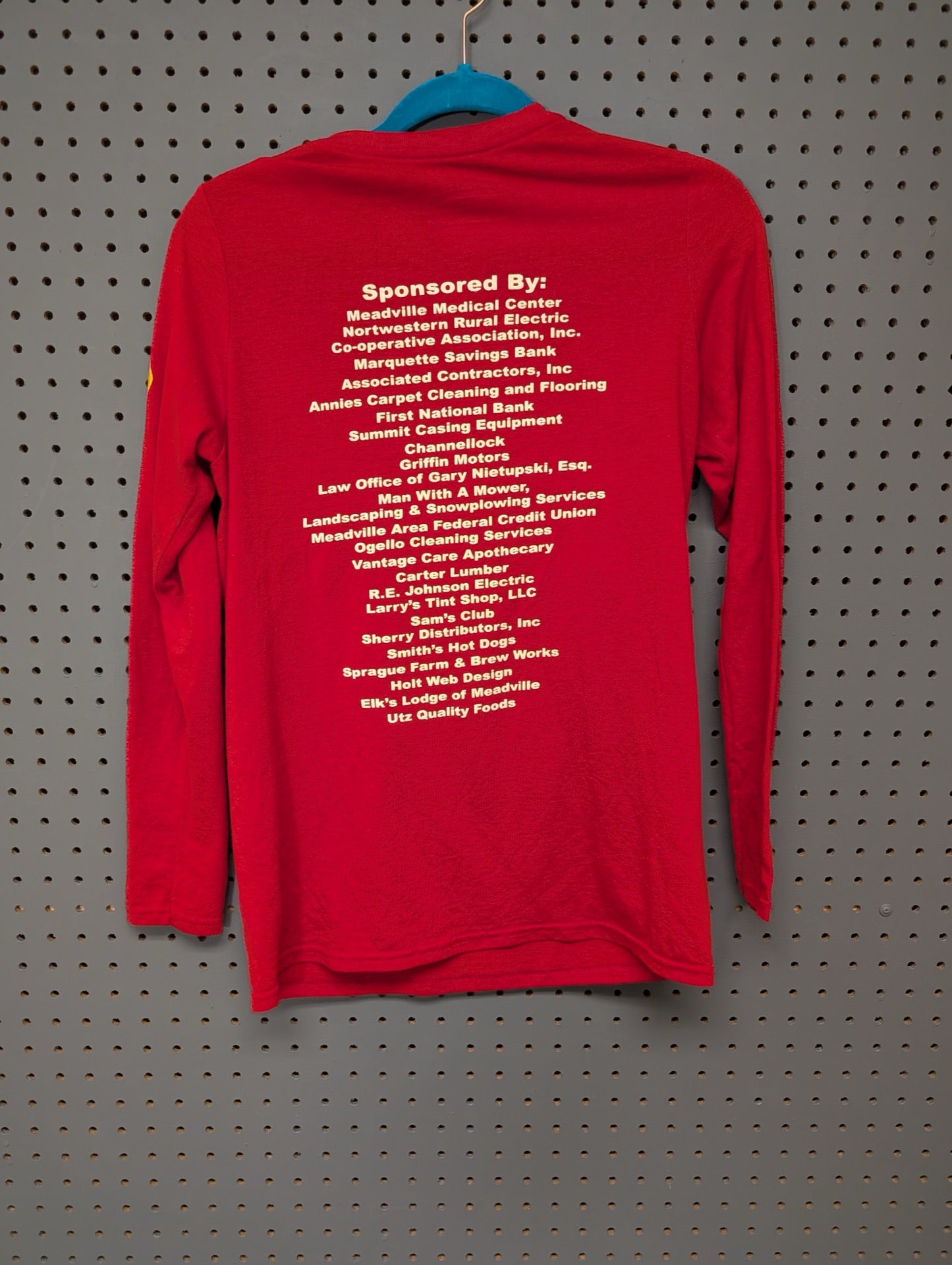 Back view of red Bethesda Mud Run shirt showing sponsors