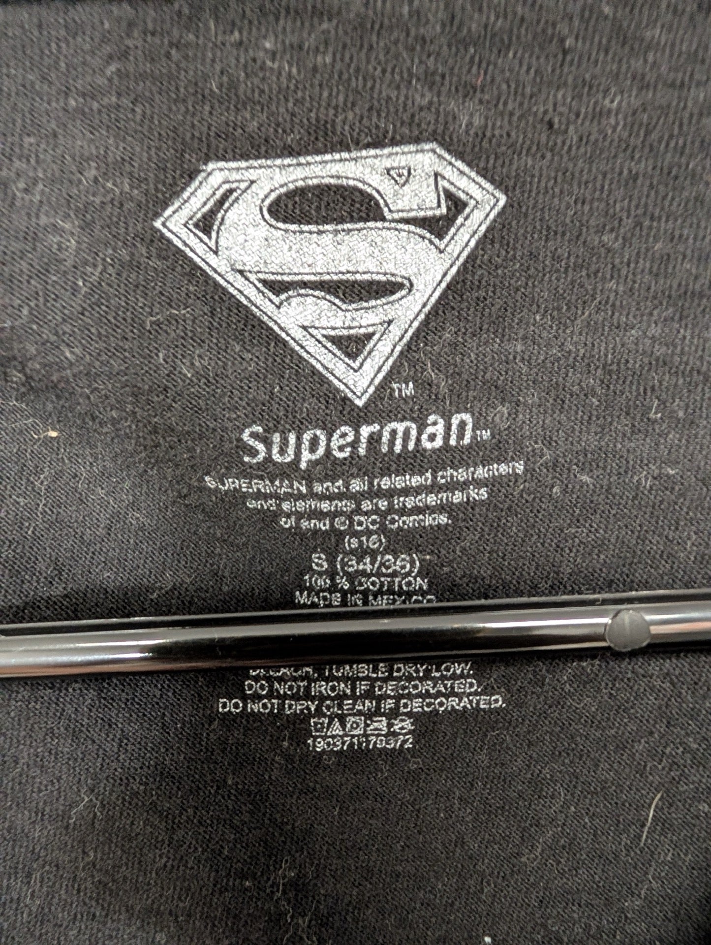 Printed inner neck tag showing Superman and DC Comics trademark