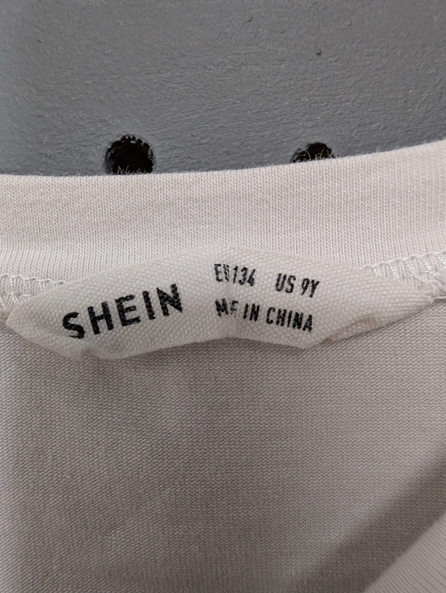 SHEIN inner neck tag showing size 9Y