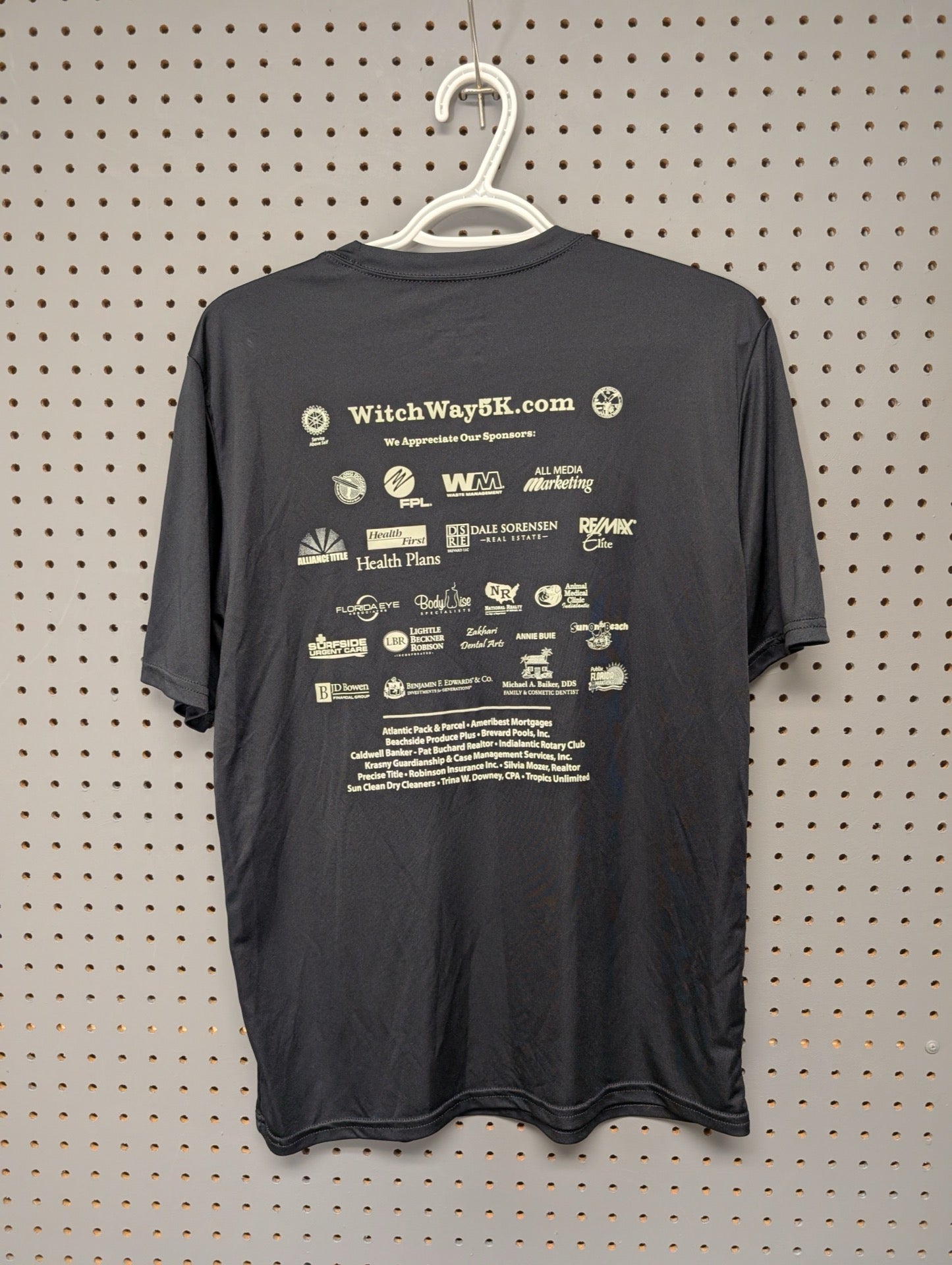 Back of shirt showing local sponsors