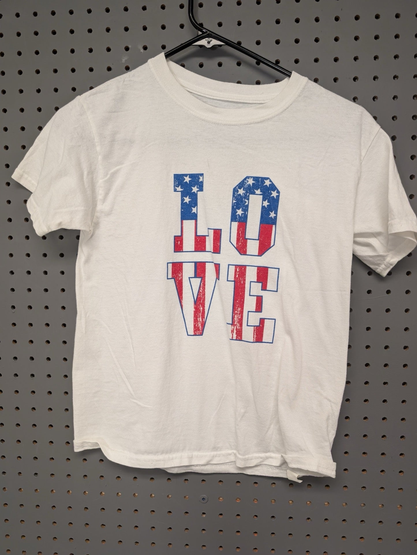 Front of white kids t-shirt with LOVE flag graphic