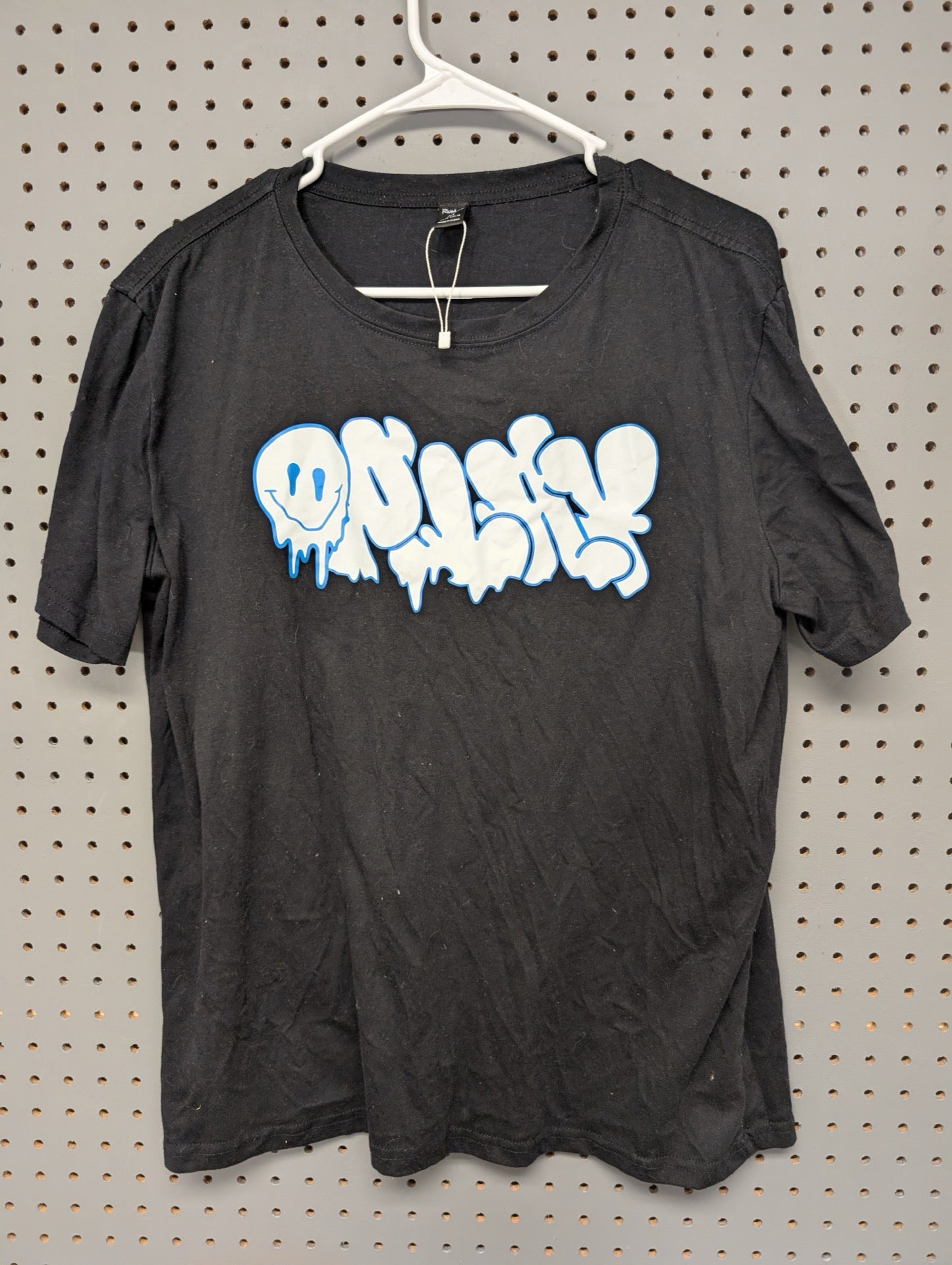 Front of black ROMWE t-shirt with drip font logo