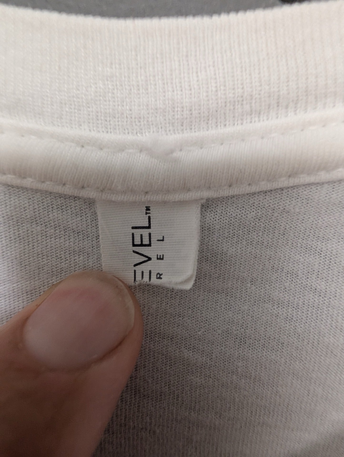 Level Revel brand tag on collar