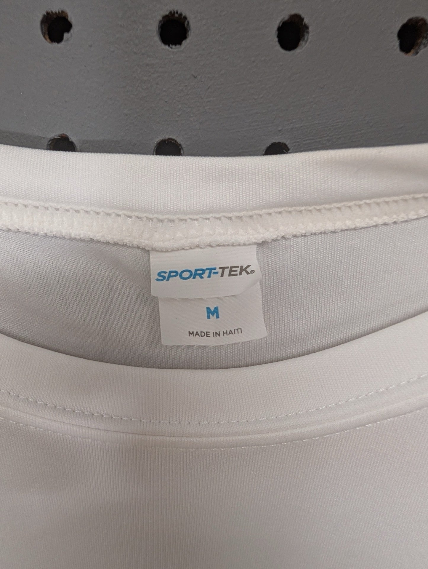 Sport-Tek brand tag size Medium Made in Haiti