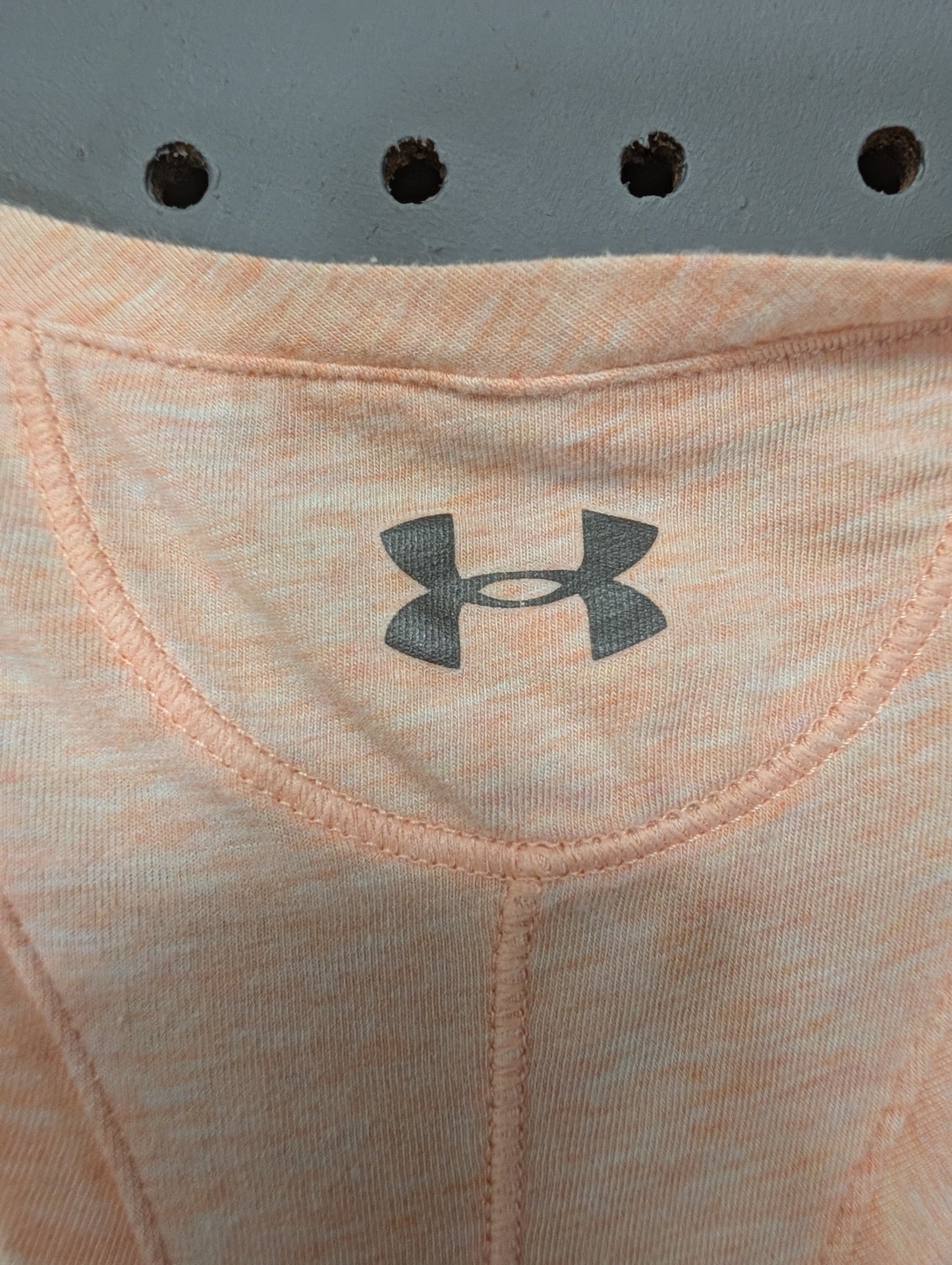 Close up of Under Armour logo on back collar