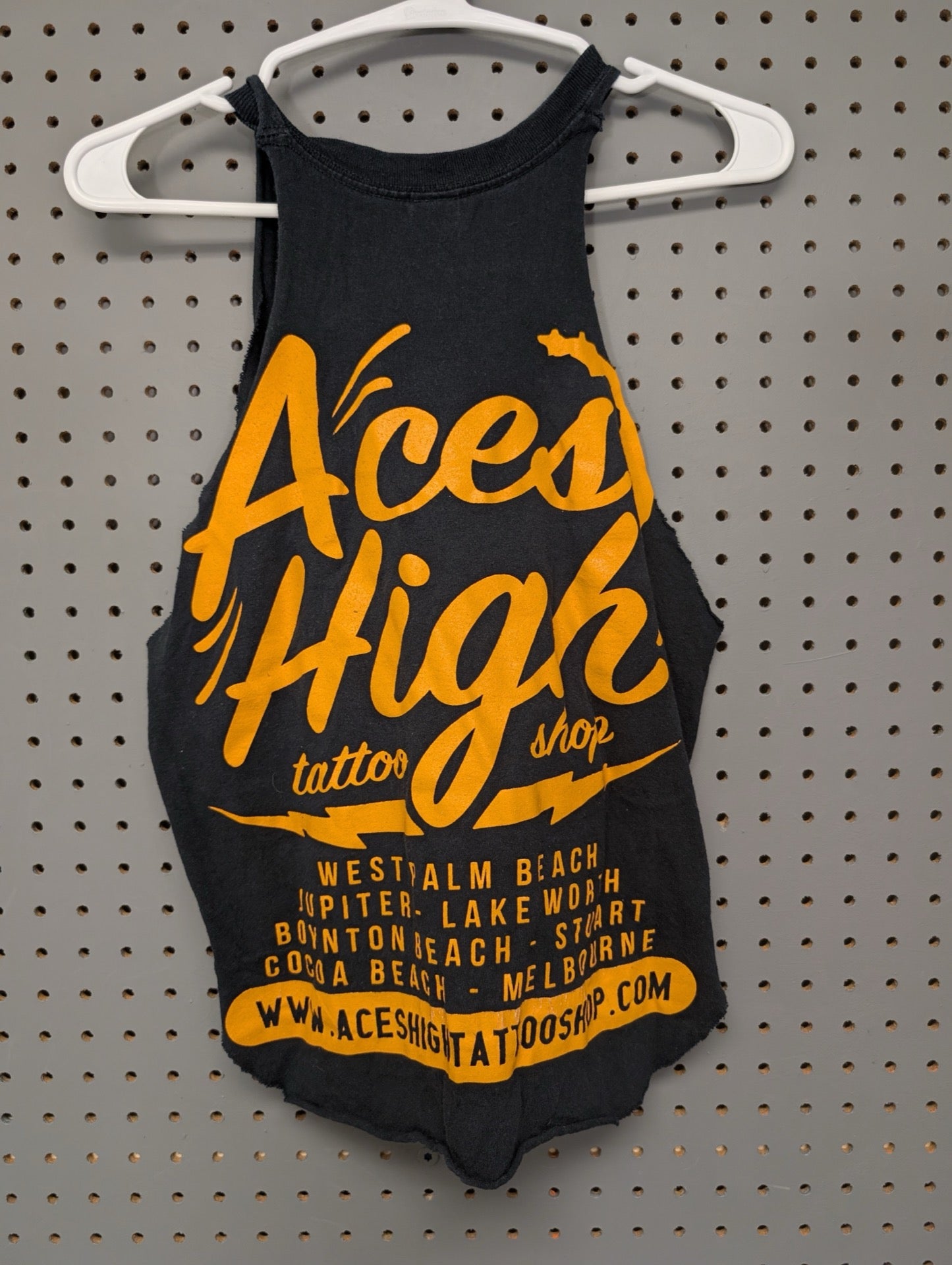 Back of shirt showing Aces High Tattoo Shop locations