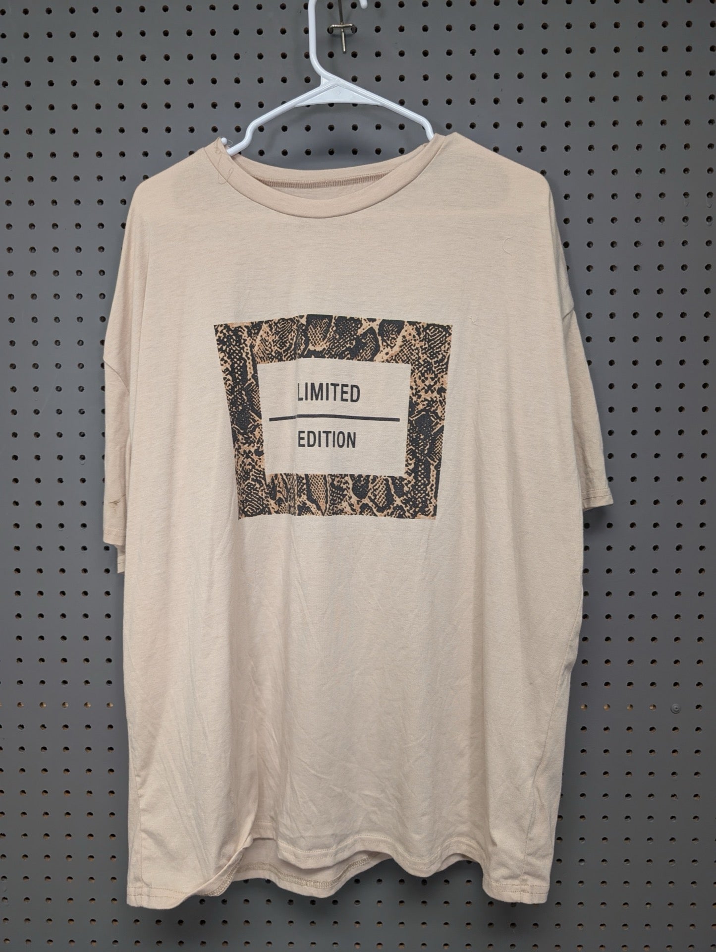 Front of beige Shein t-shirt with snakeskin limited edition graphic