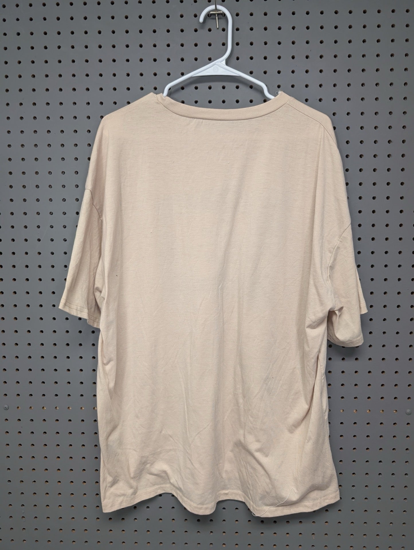 Back of plain beige oversized t-shirt