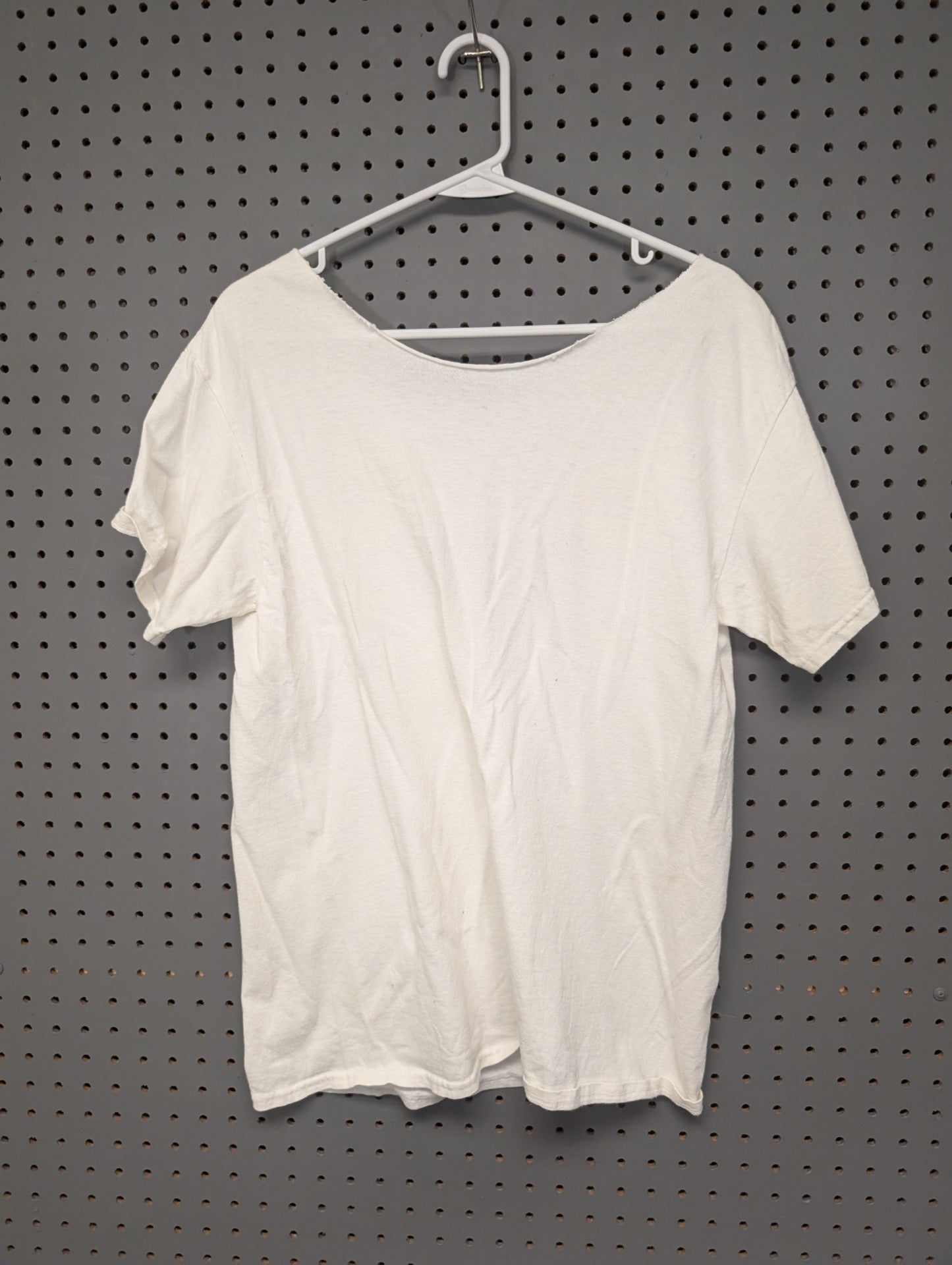 Back of white modified cut neck t-shirt