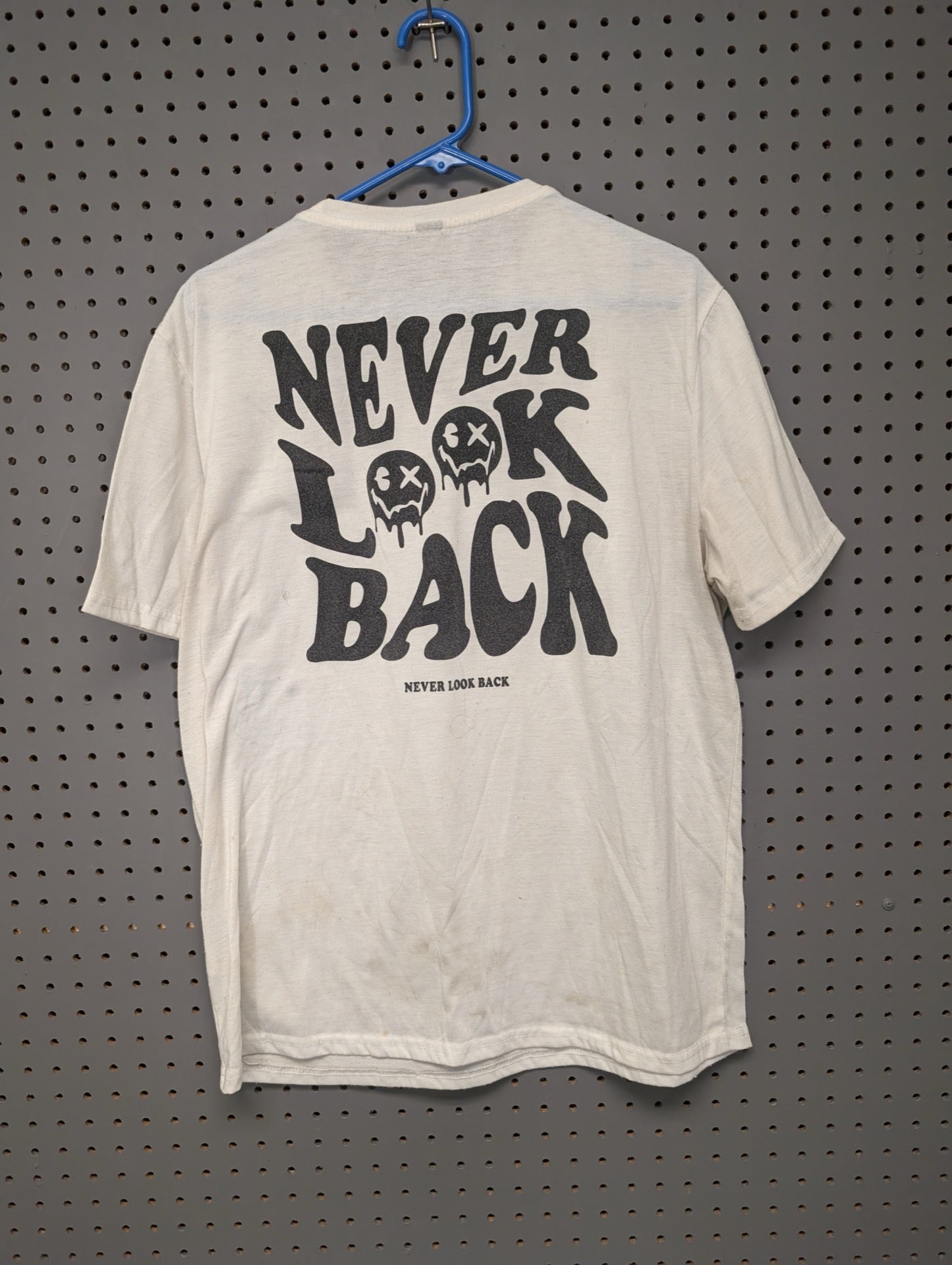 Back of shirt with Never Look Back graphic