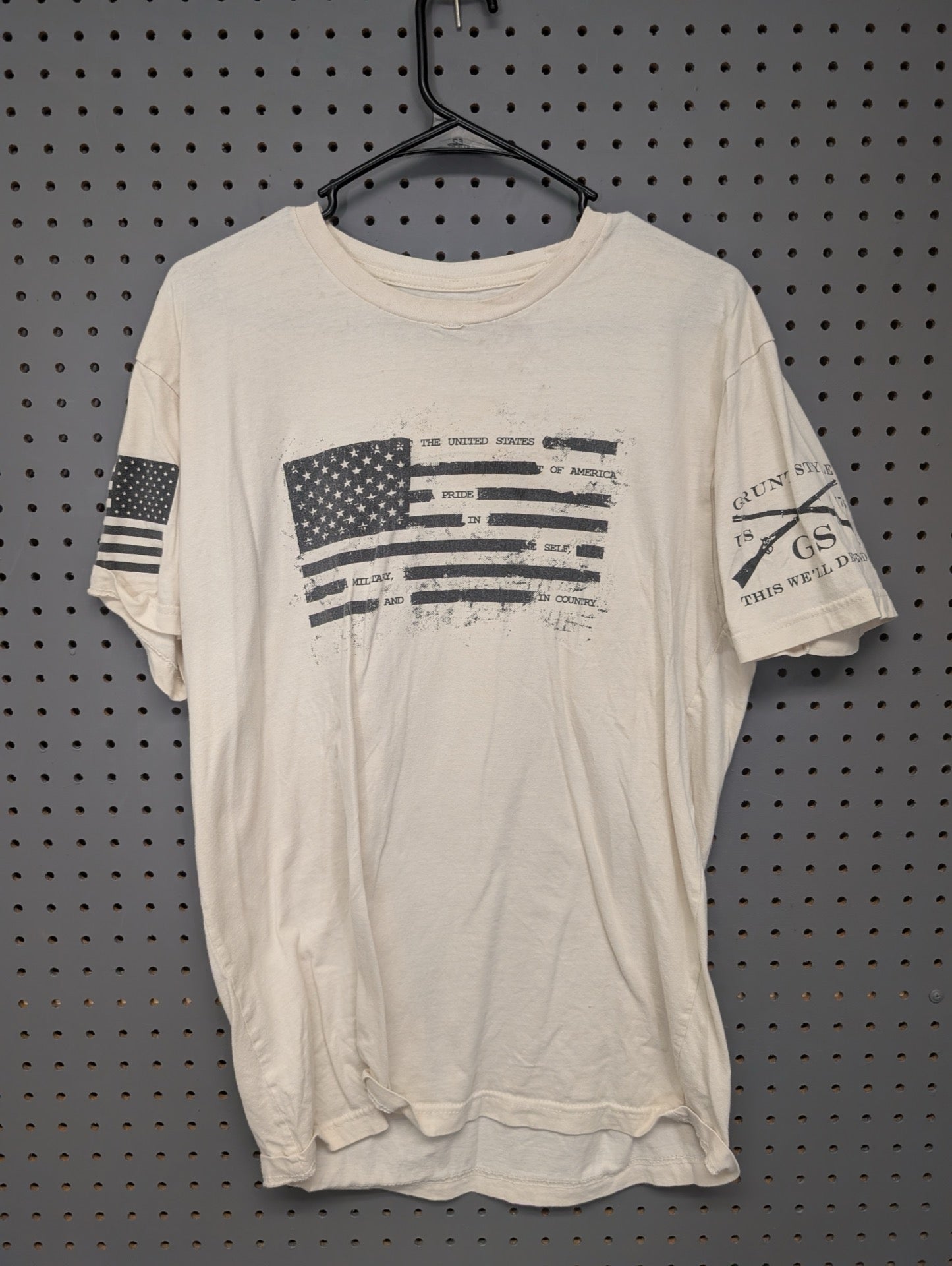 Front view of cream Grunt Style t-shirt with distressed flag graphic