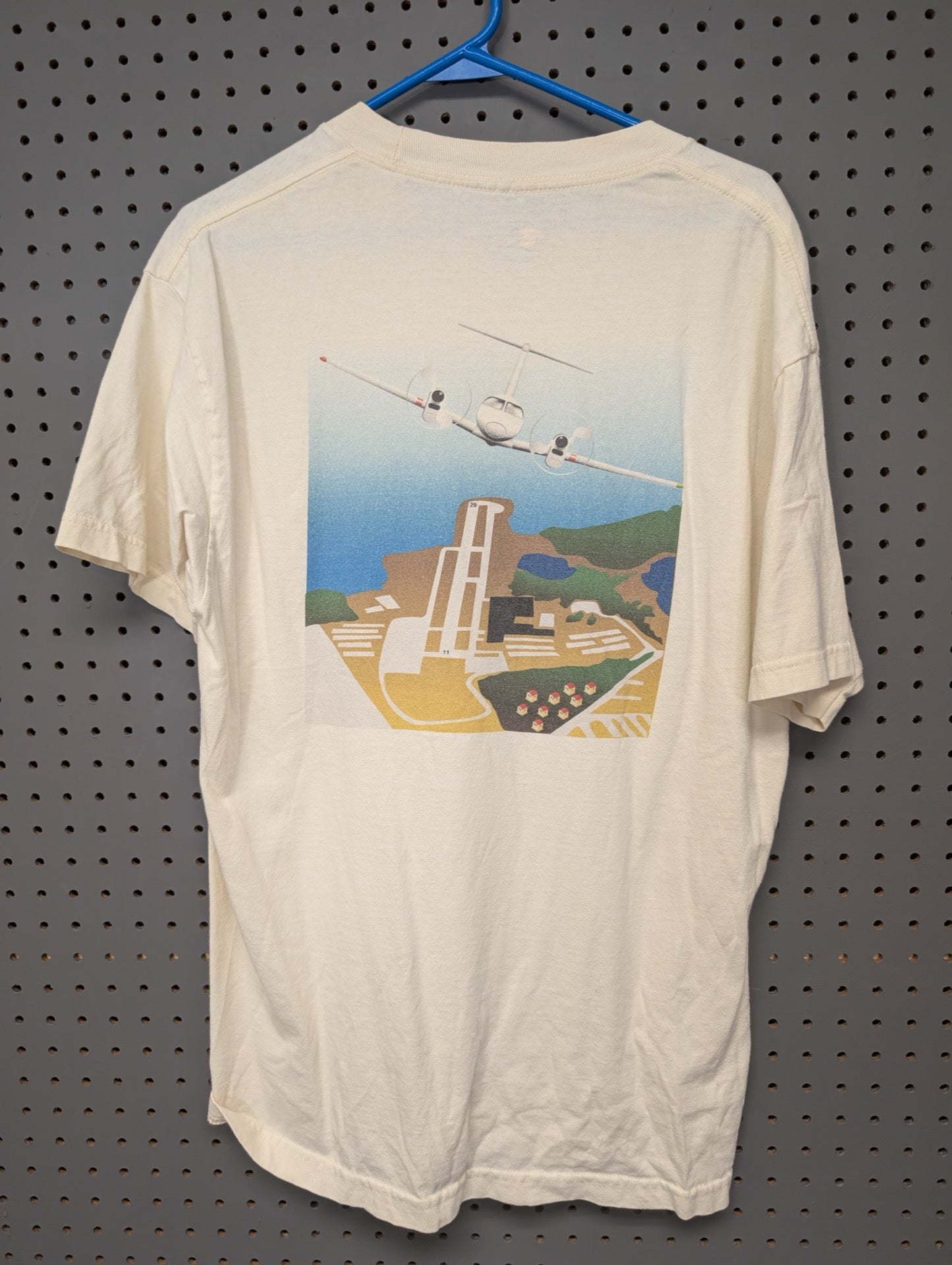 Back of t-shirt with large airplane and runway graphic