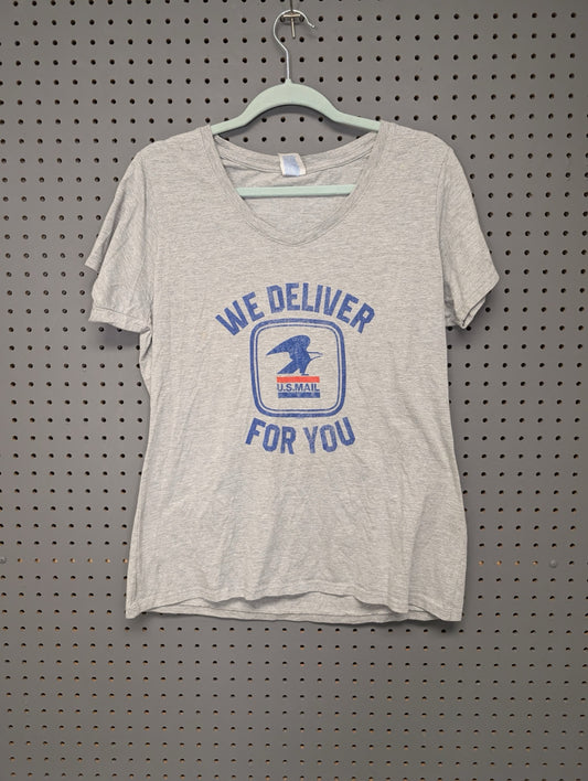 Front of grey v-neck t-shirt with USPS We Deliver For You graphic