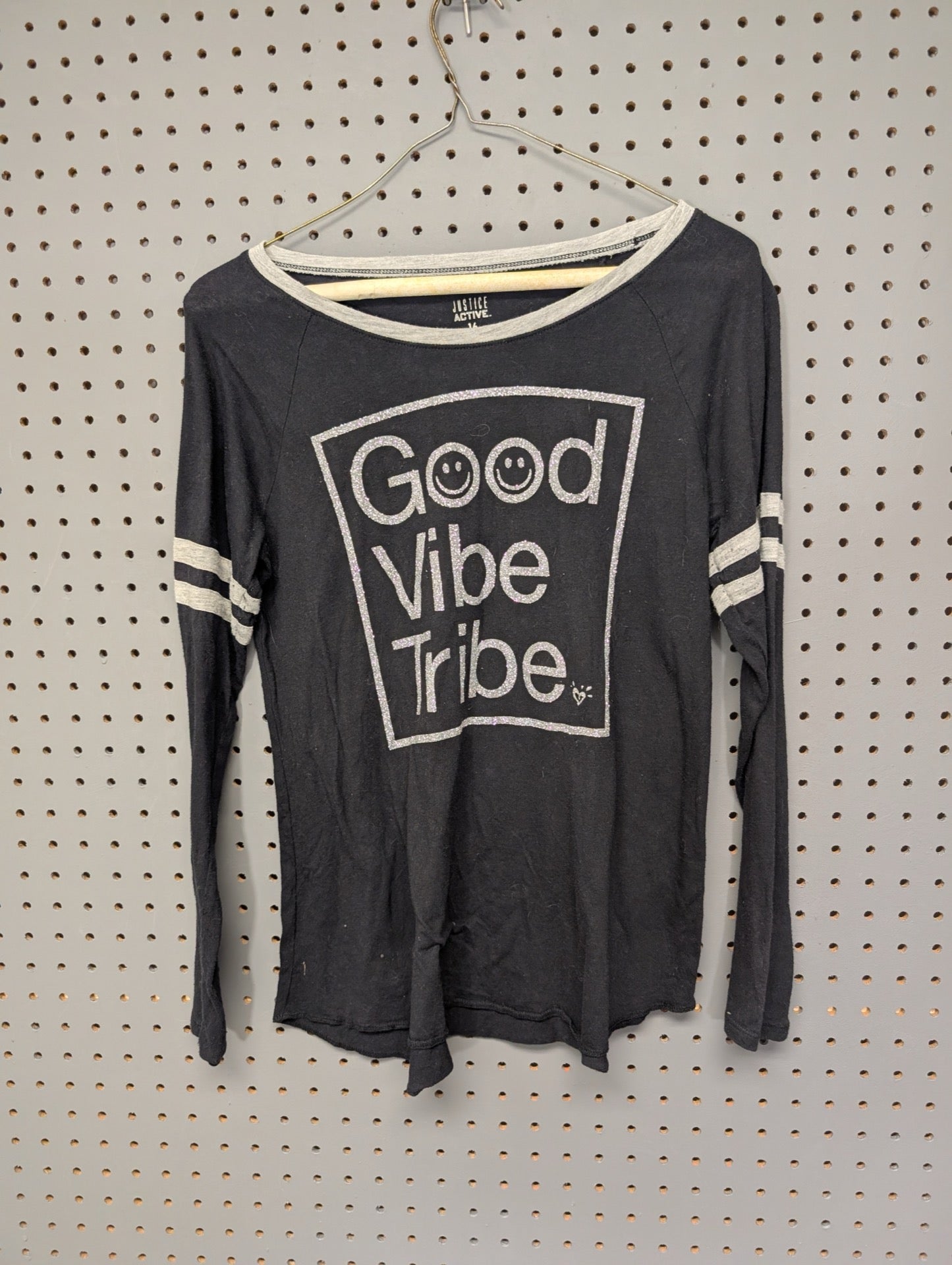 Front of black Justice Active long sleeve top with Good Vibe Tribe graphic