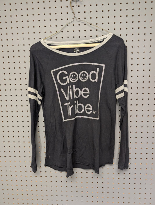 Front of black Justice Active long sleeve top with Good Vibe Tribe graphic