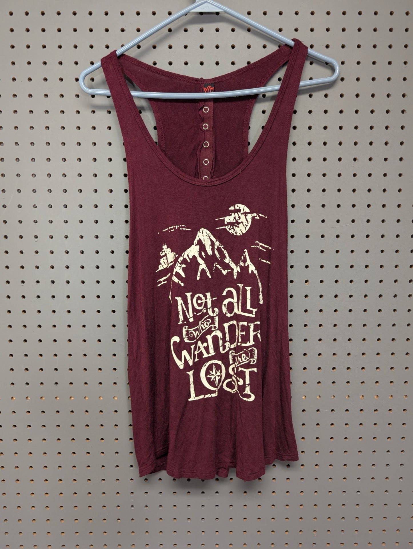 Front of burgundy tank top with Not All Who Wander Are Lost graphic