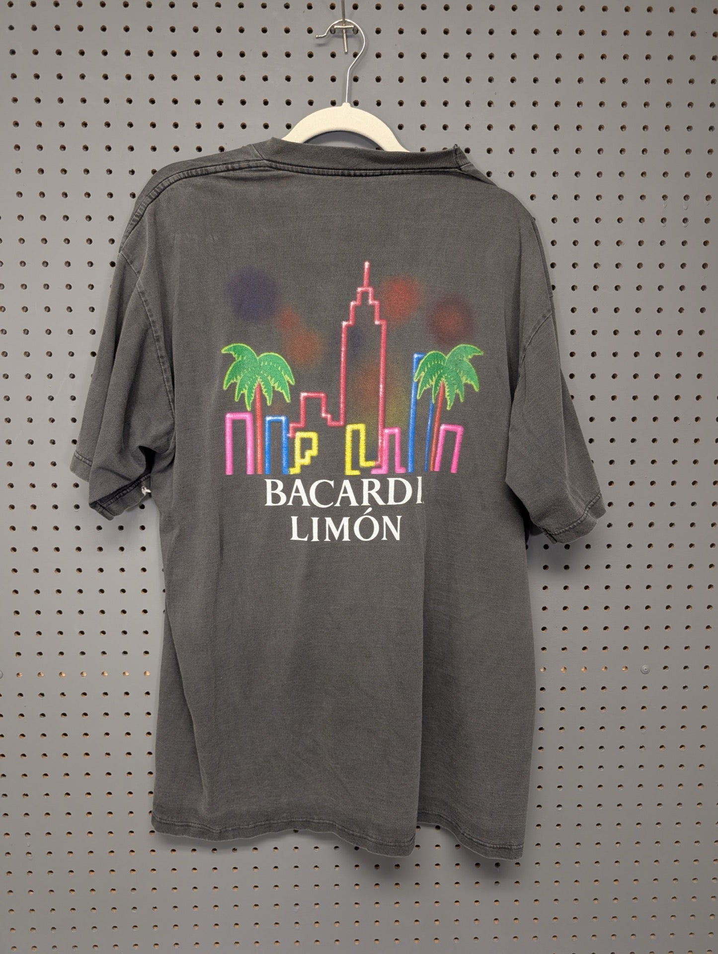 Back of t-shirt with neon city skyline graphic
