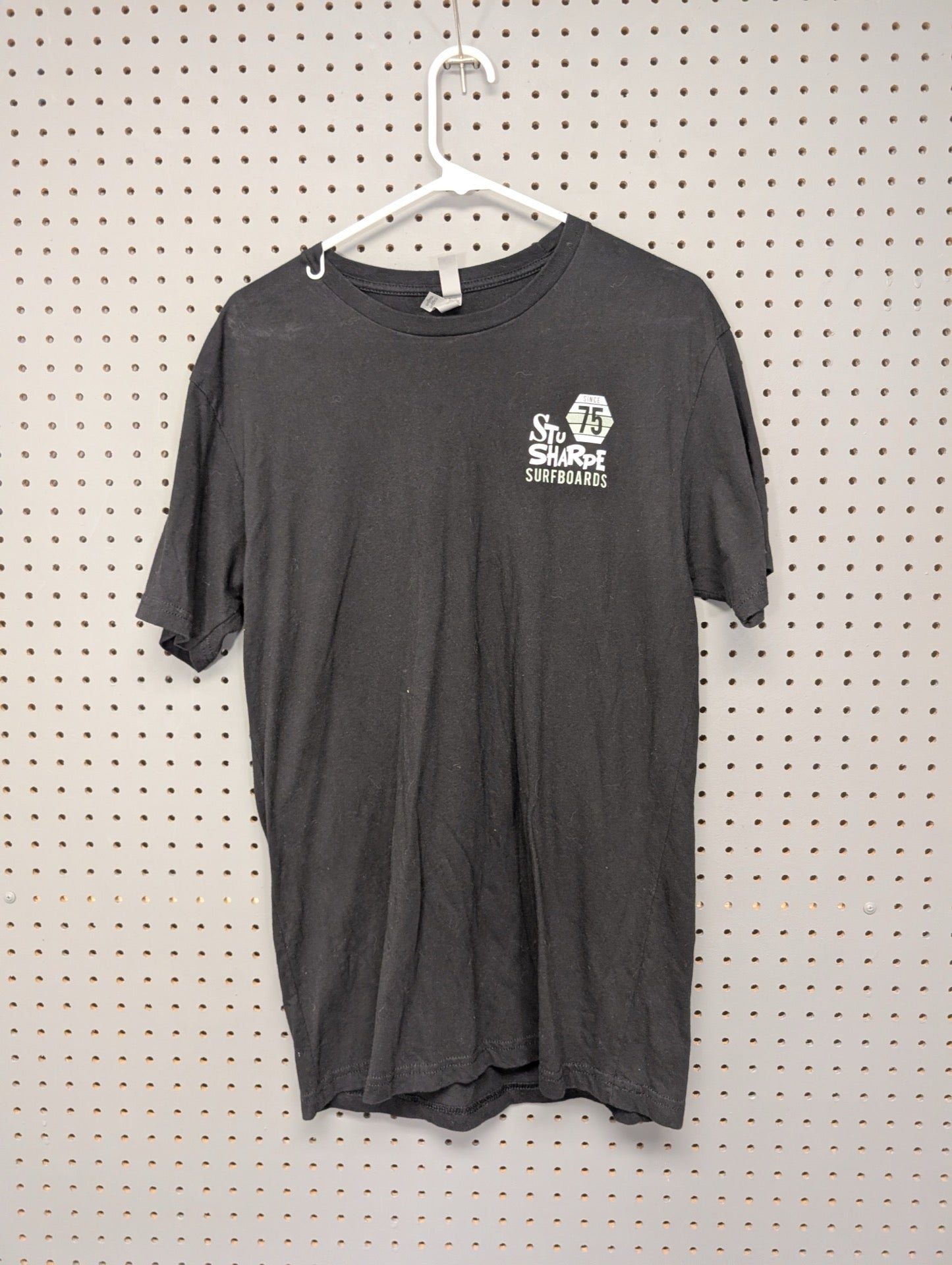 Front of black Stu Sharpe Surfboards t-shirt