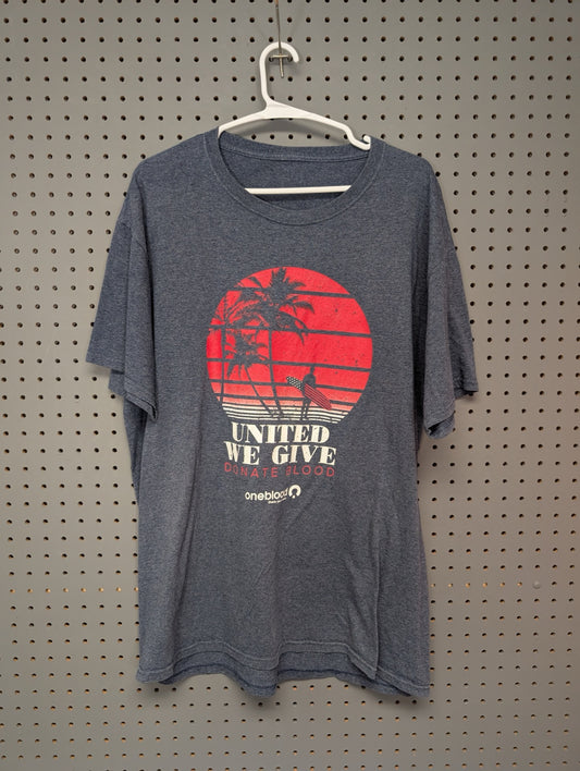 Front of blue heather Oneblood t-shirt with sunset graphic