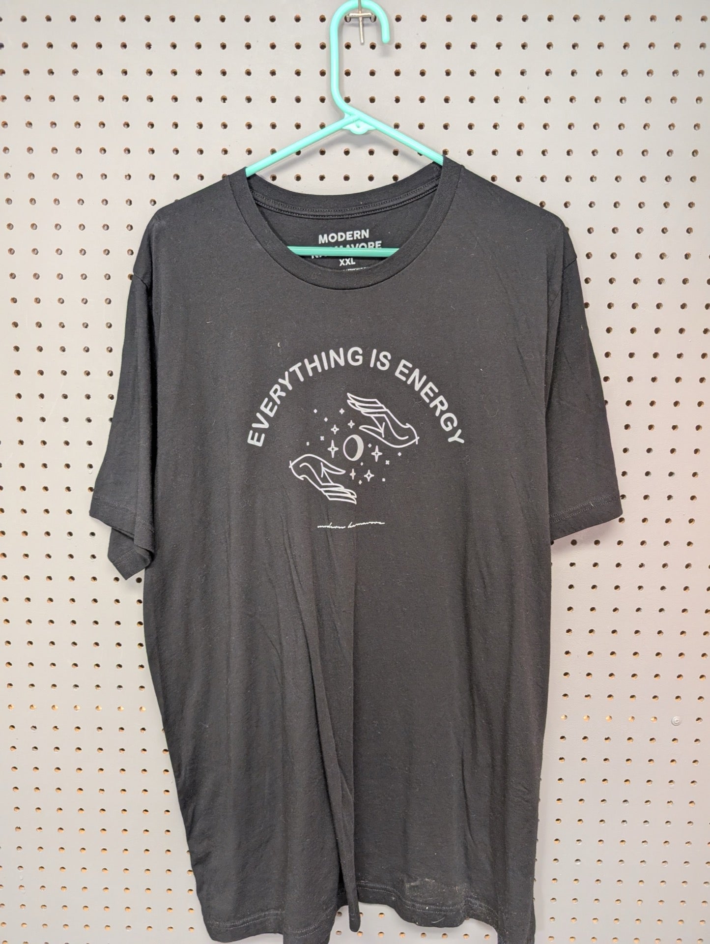 Front of black Modern Karmavore t-shirt