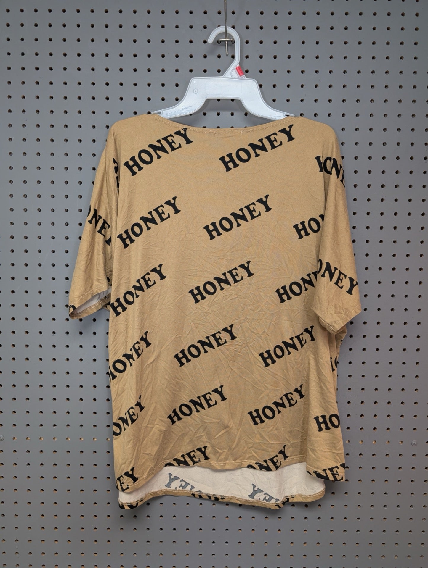 Back of tan all-over print t-shirt