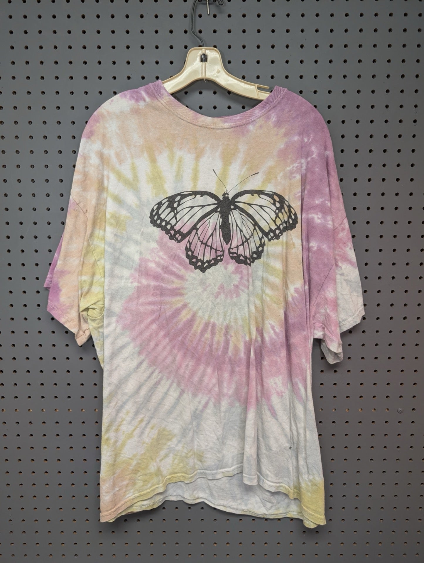 Front of pastel tie-dye t-shirt with butterfly graphic