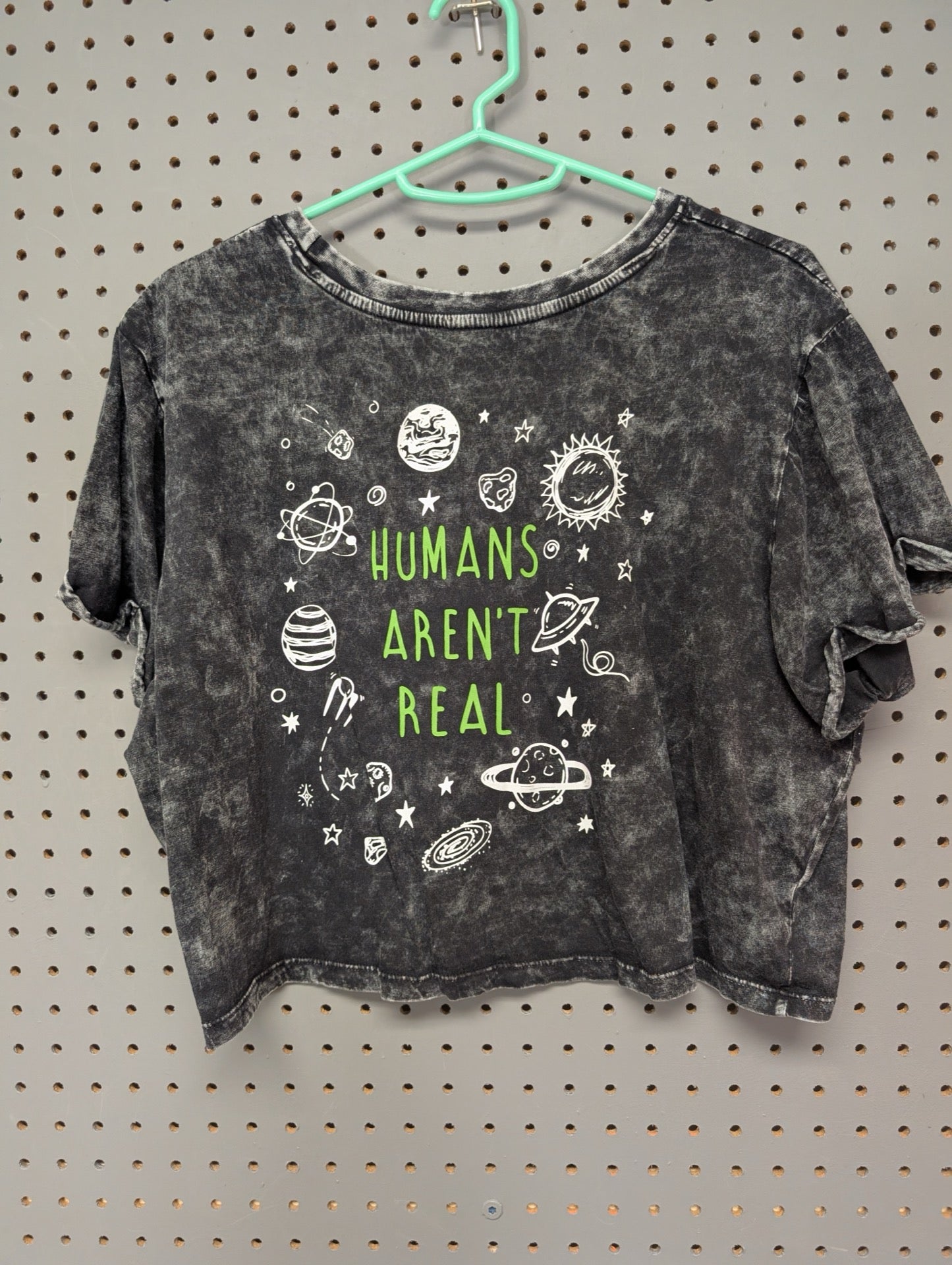 Back of crop top with space and Humans Aren't Real graphic