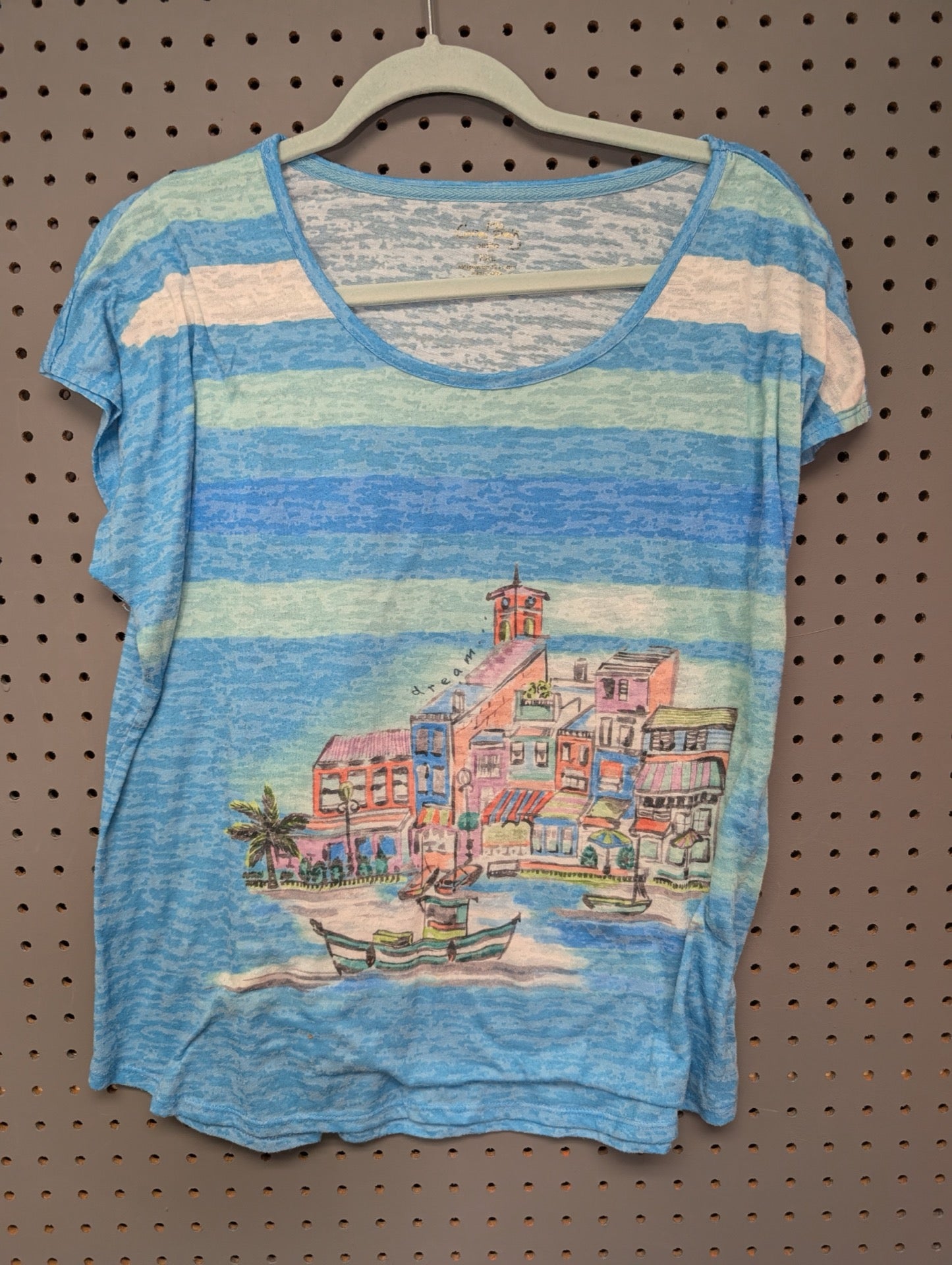 Front view of Coral Bay blue scenic coastal t-shirt