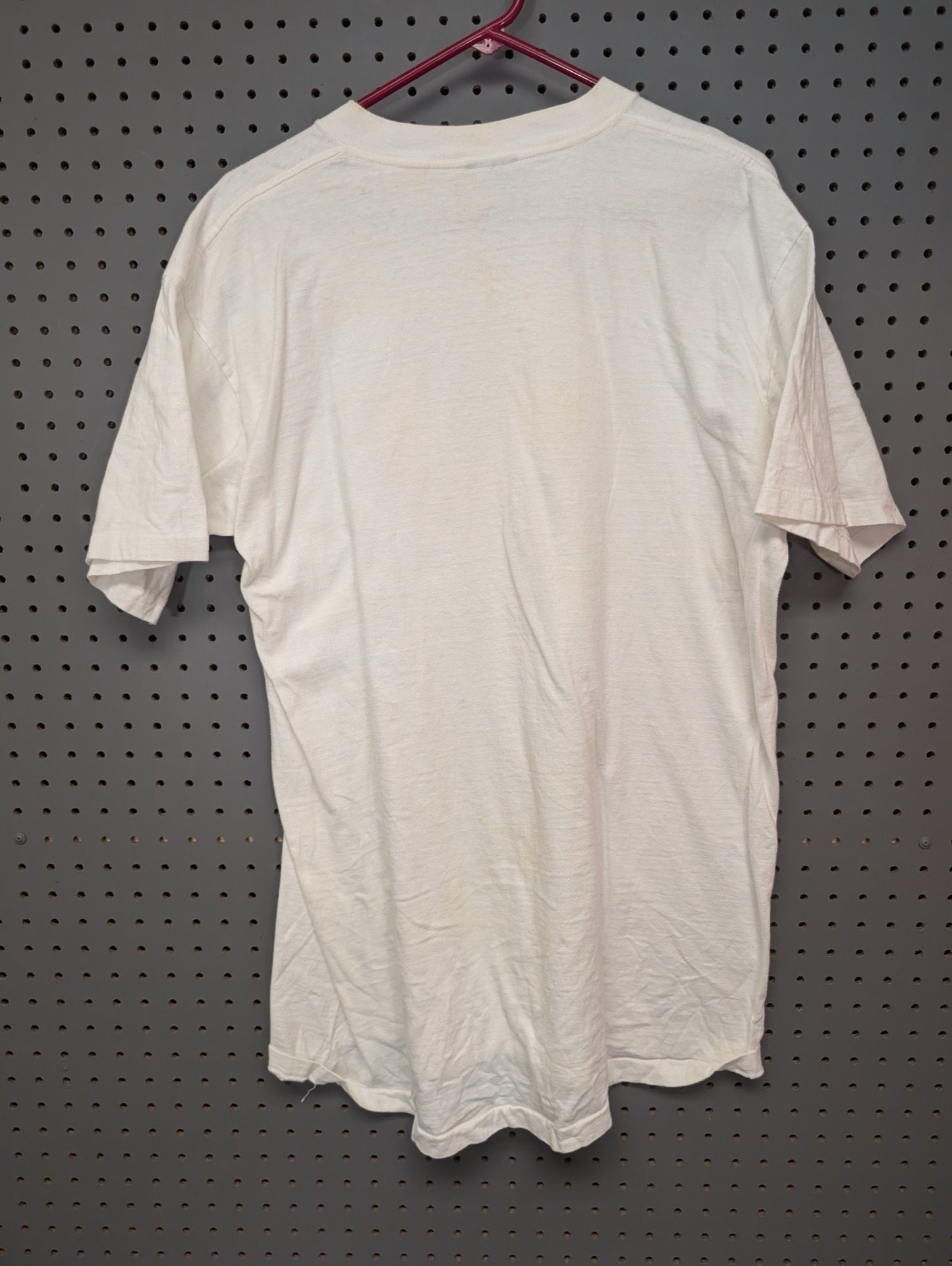 Back view showing yellowing on white t-shirt