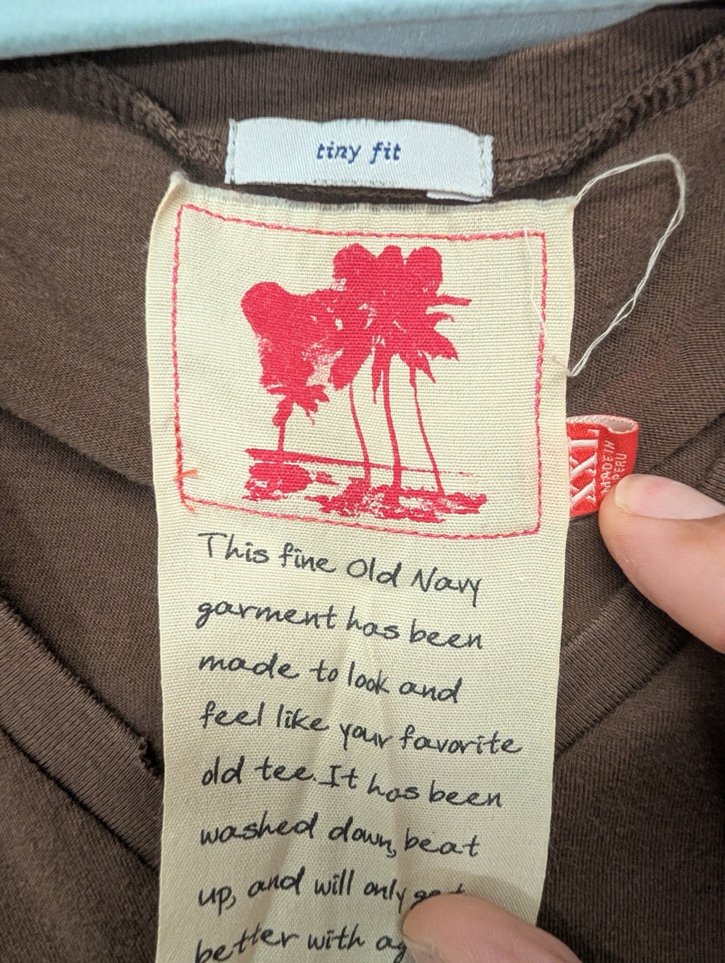 Close up of Old Navy Tiny Fit tag and descriptive label