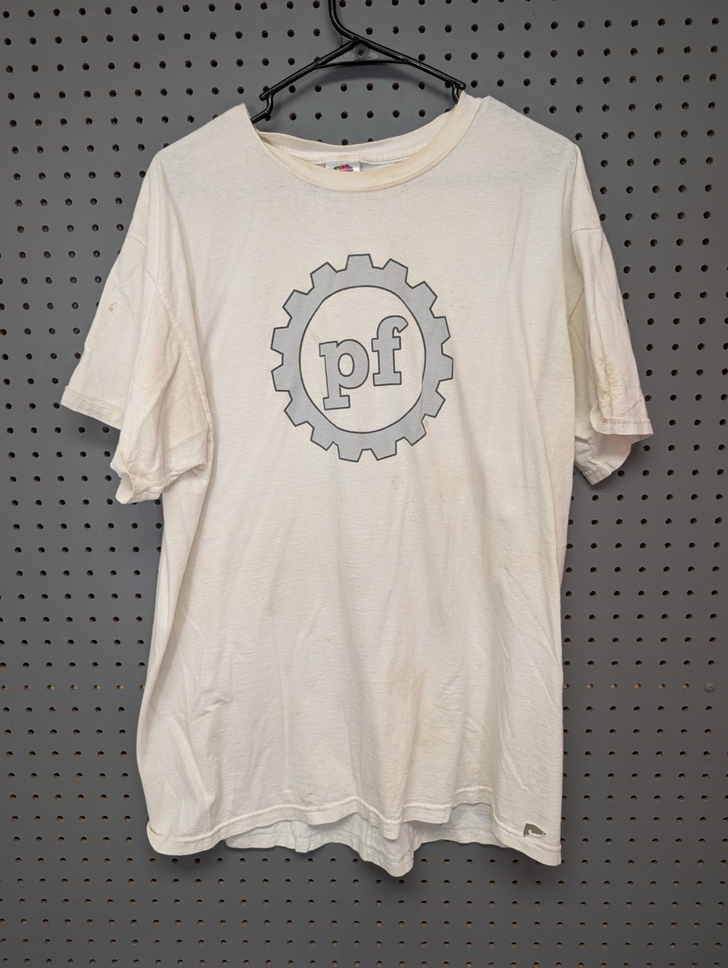 Front view of white t-shirt with pf gear logo showing stains