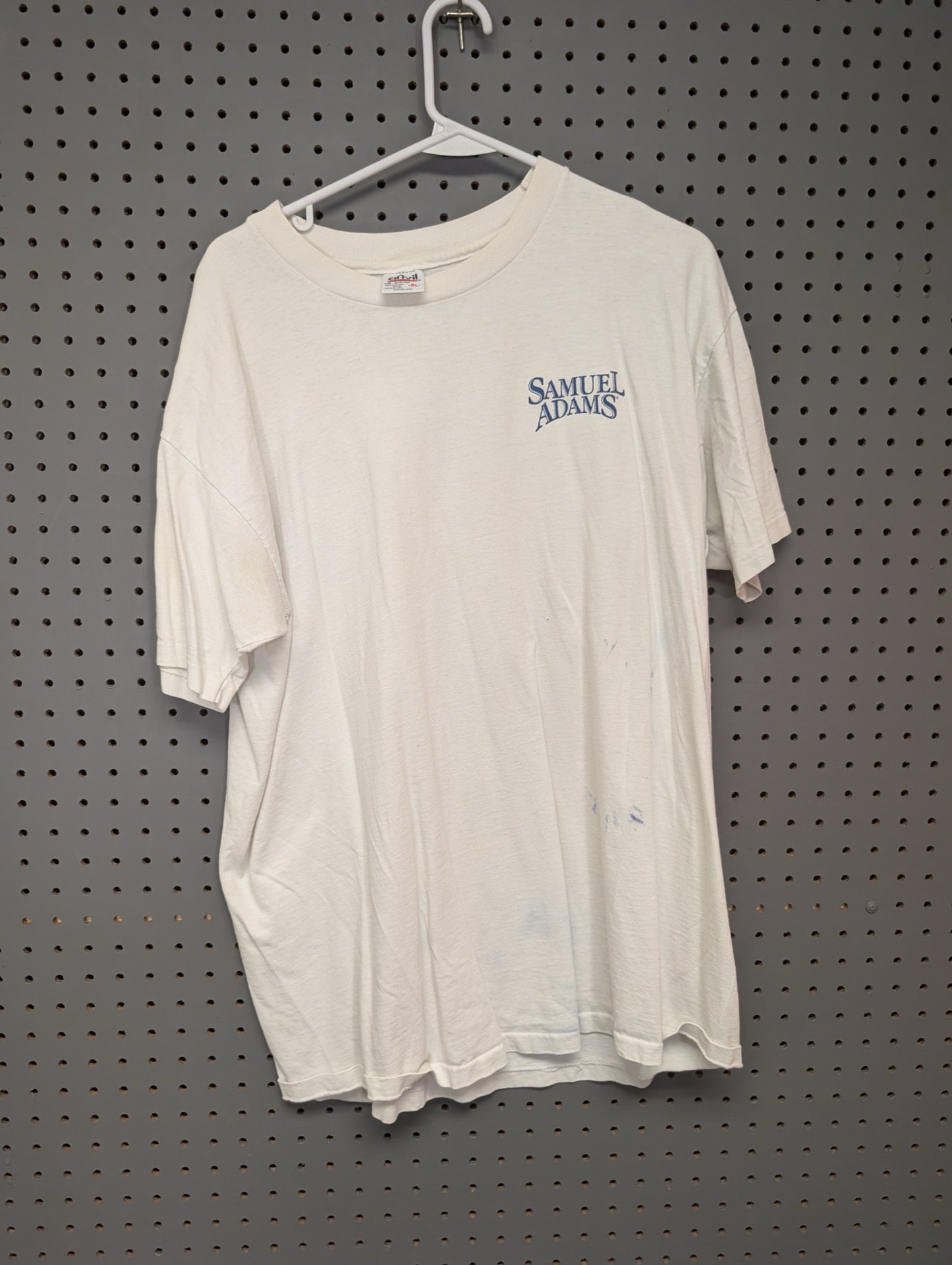 Front view of white Samuel Adams t-shirt showing blue stains