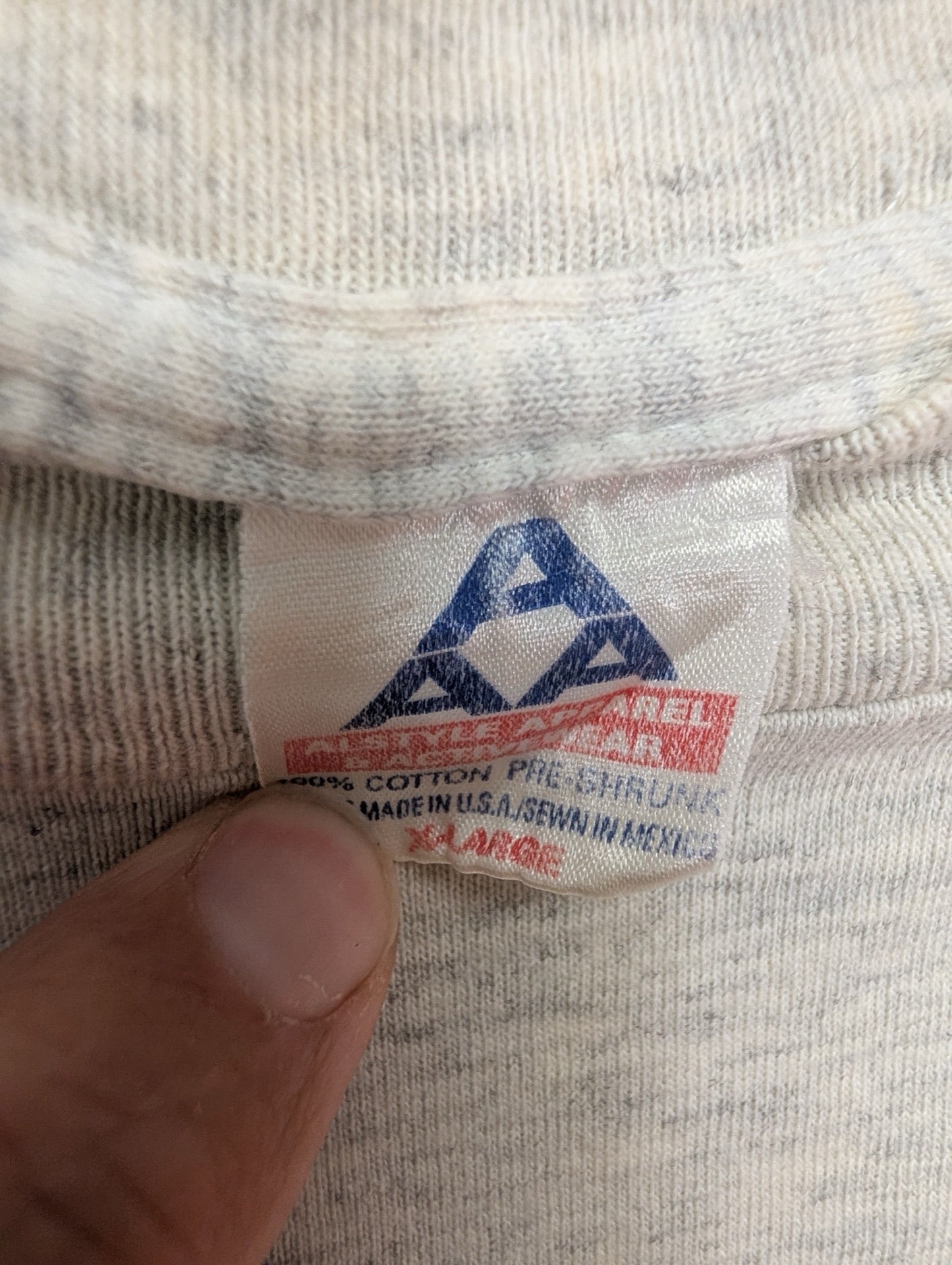 Close up of vintage AAA size XL tag