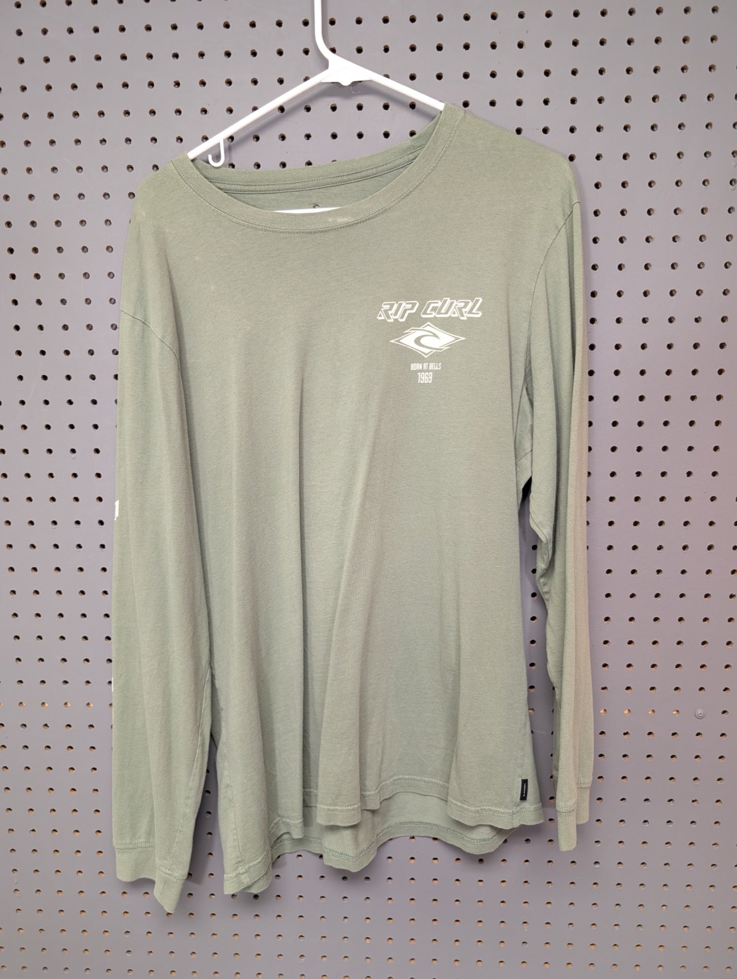 Front view of olive green Rip Curl long sleeve shirt