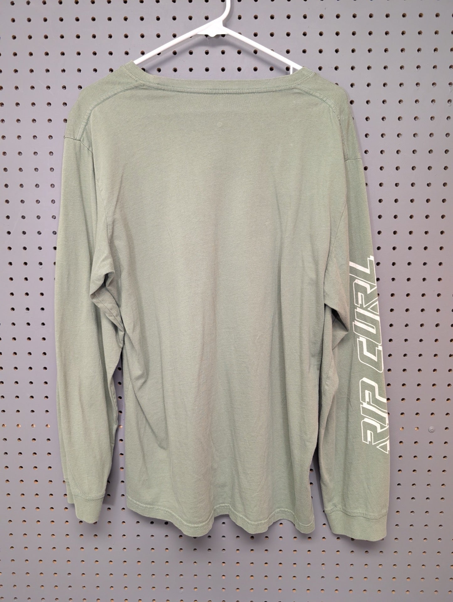 Back view of olive green Rip Curl long sleeve shirt with sleeve text