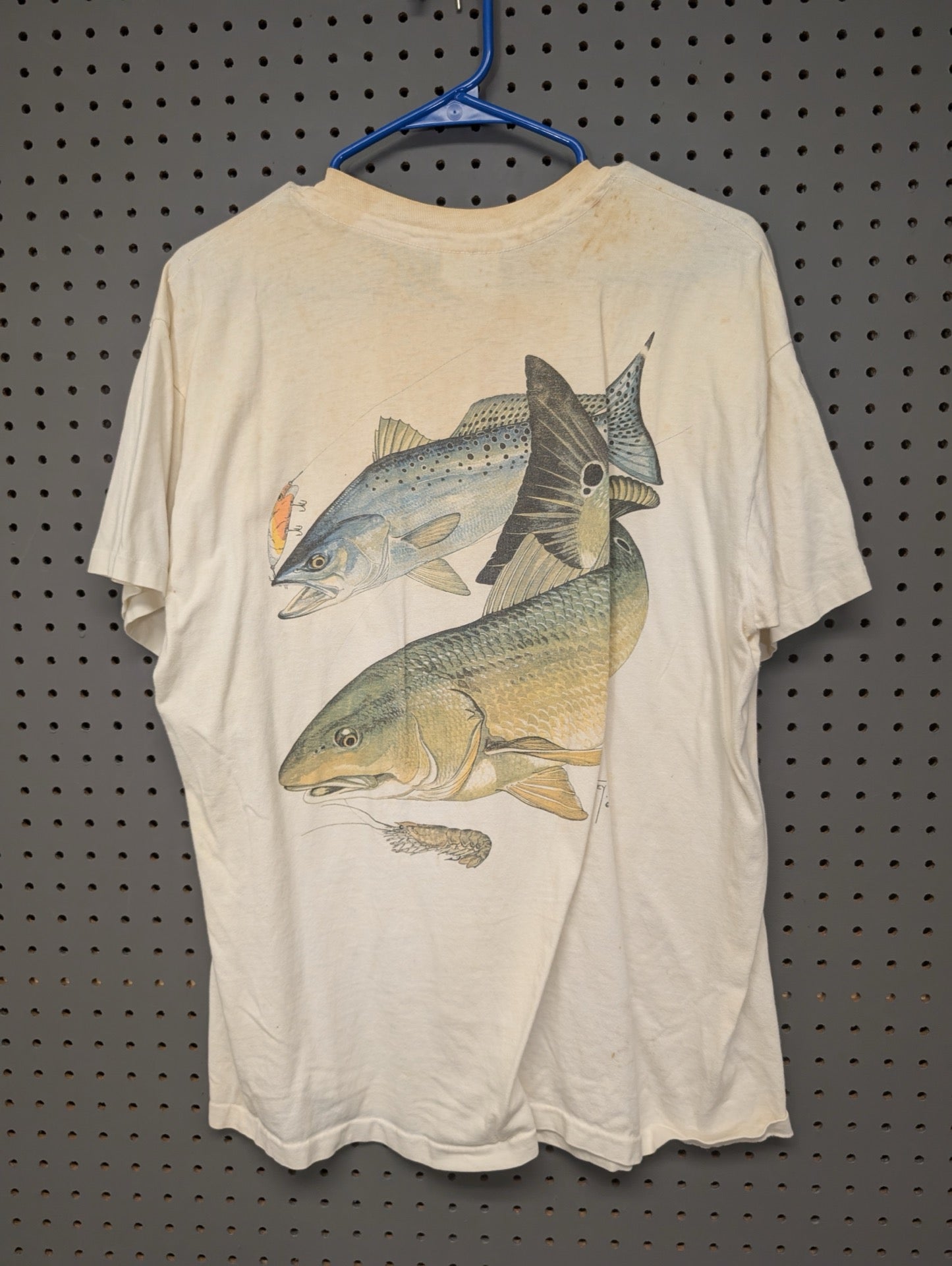 Back of vintage Guy Harvey t-shirt with fish graphic and stains