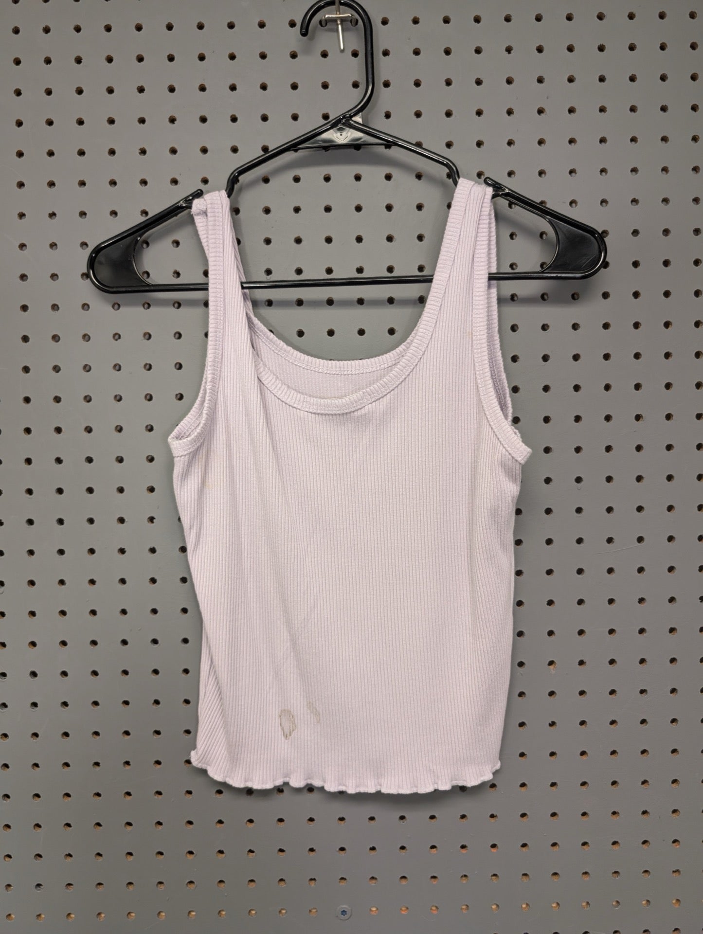 Back of lilac ribbed tank showing stains near hem