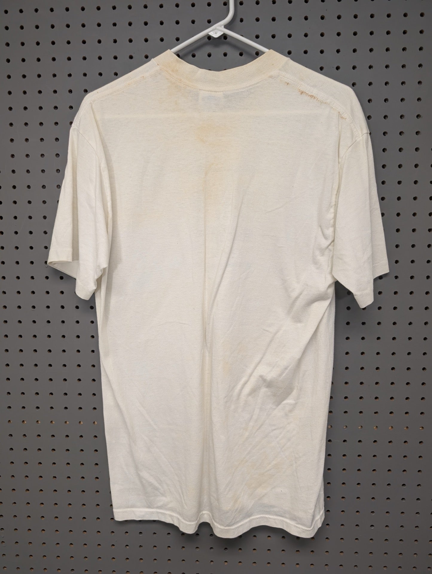 Back of vintage off-white novelty t-shirt showing stains