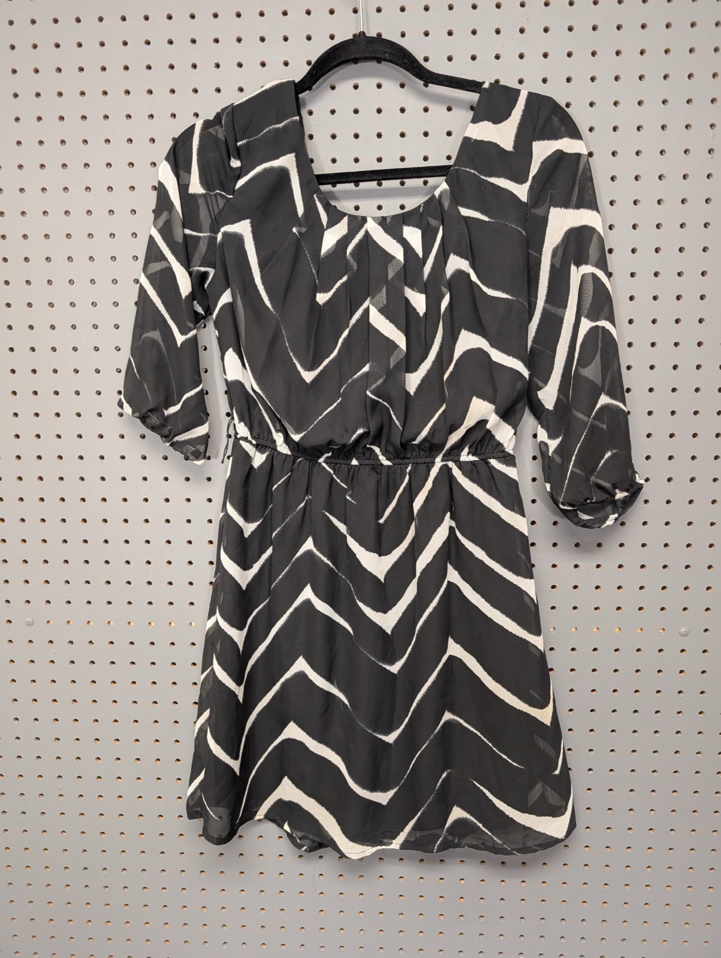 Front view of black and white abstract mini dress
