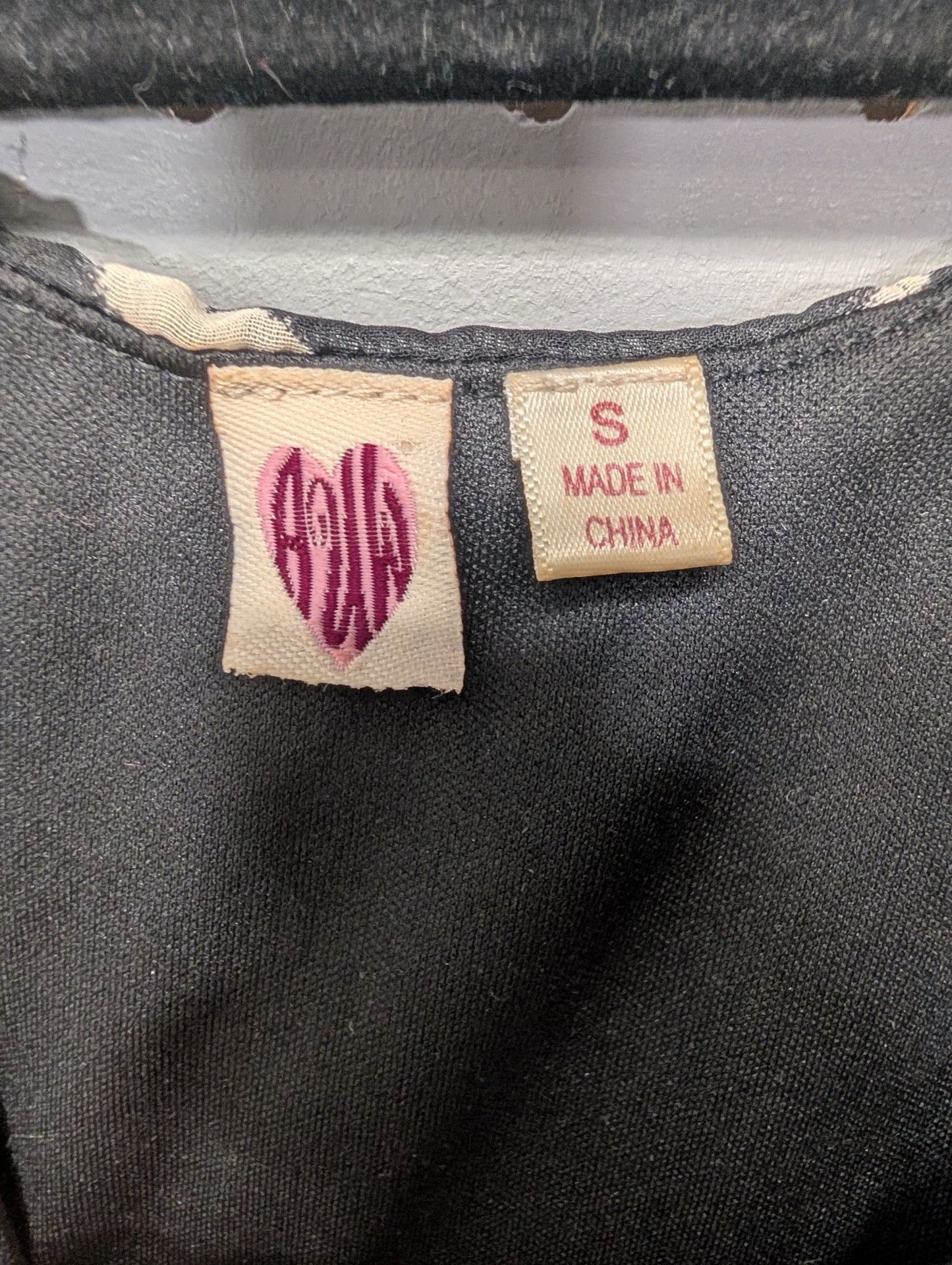 Size tag for black and white dress small