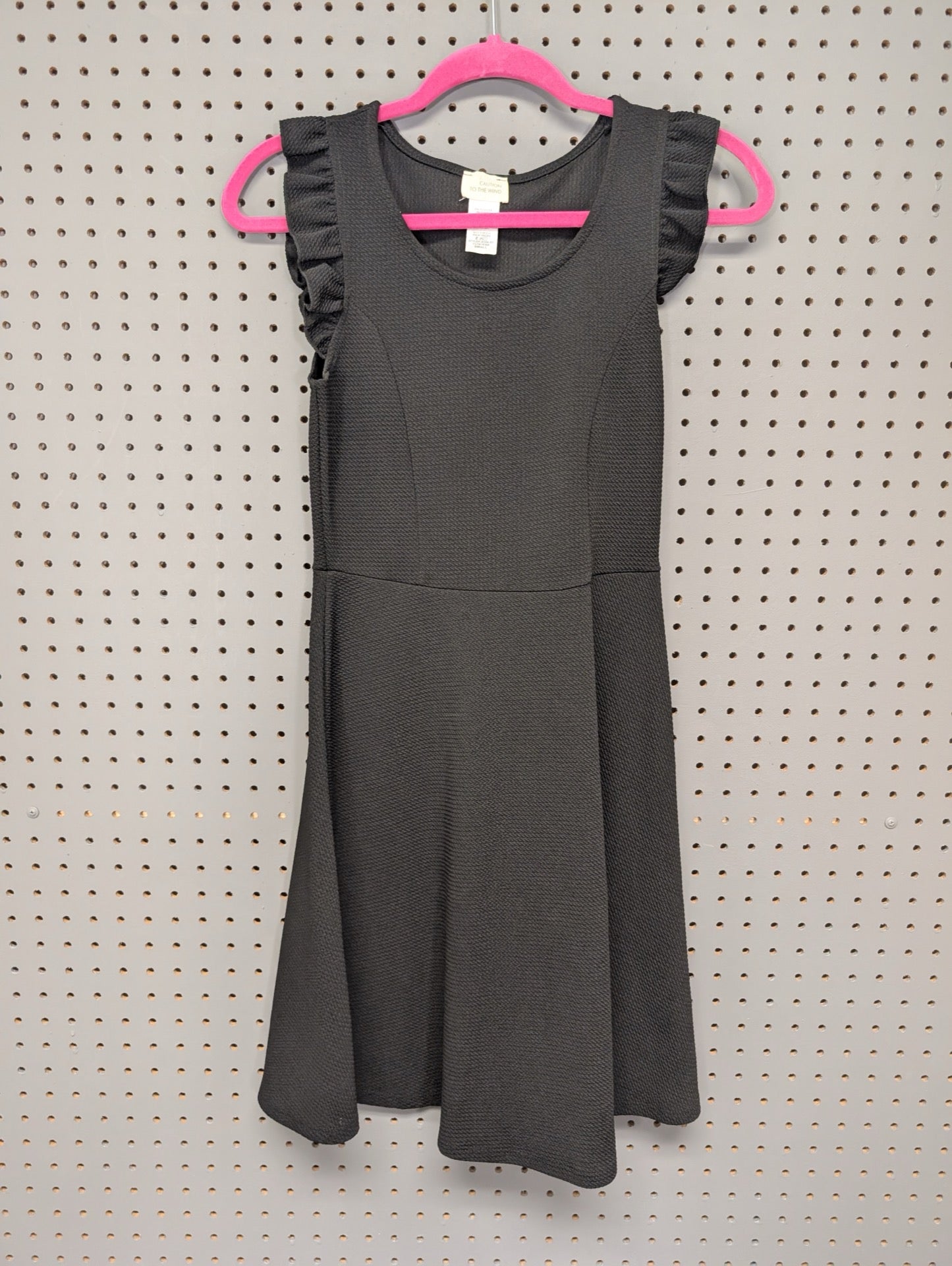 Front view of black textured skater dress