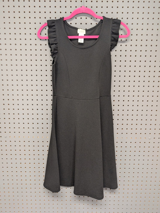 Front view of black textured skater dress