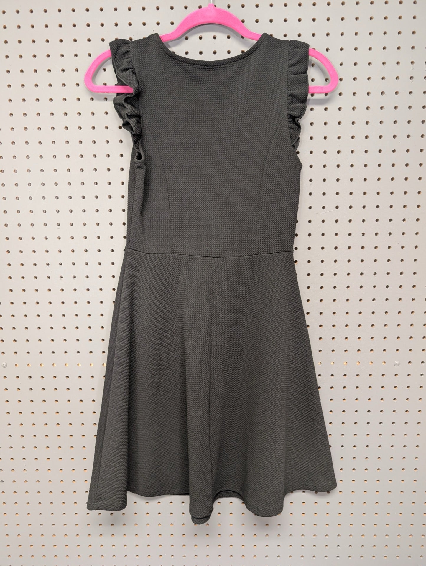 Back view of black ruffle sleeve dress