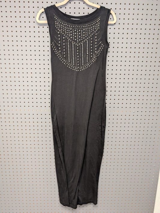 Front view of black sleeveless dress with silver studs