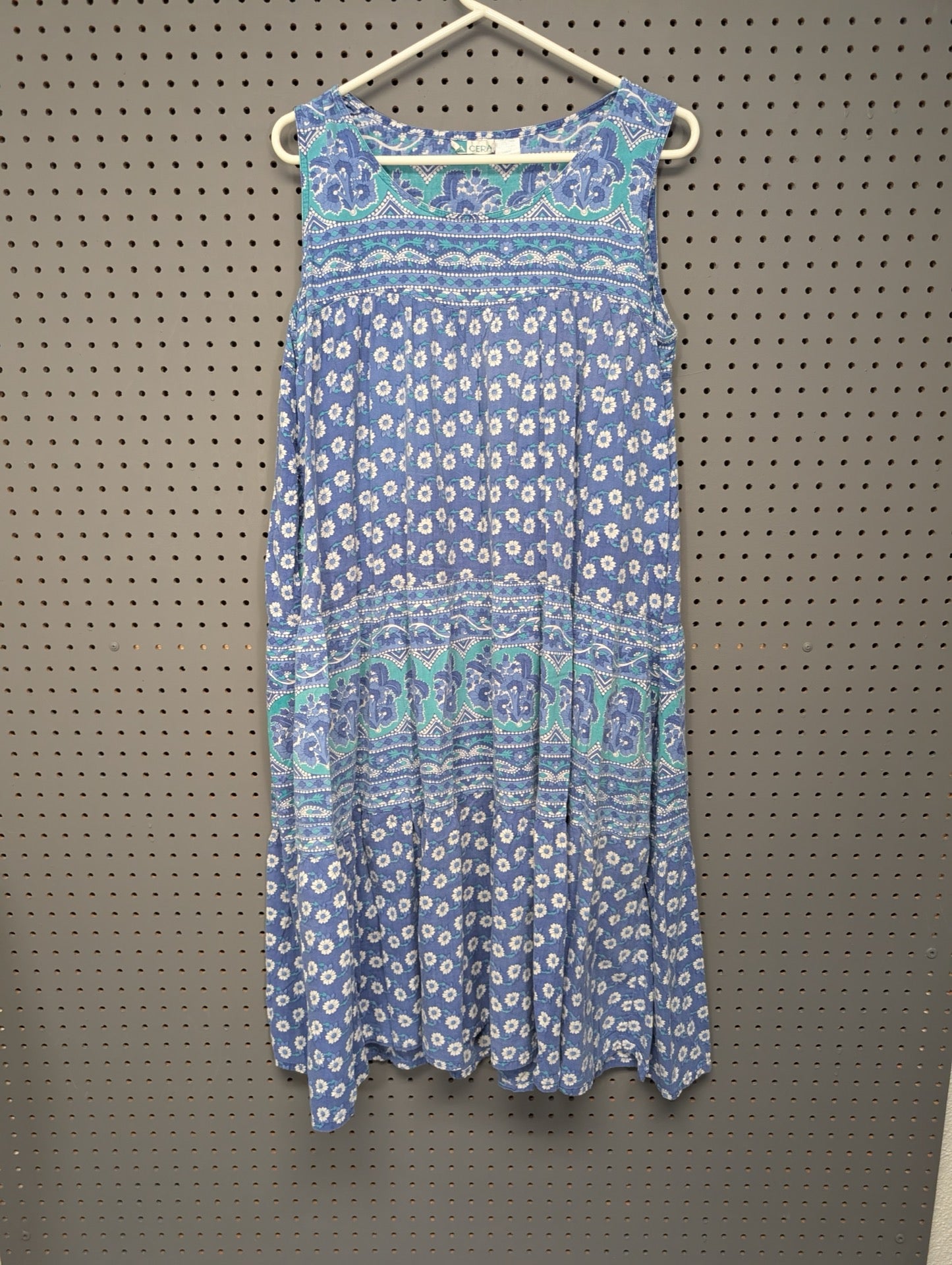 Front view of La Cera blue floral tiered dress